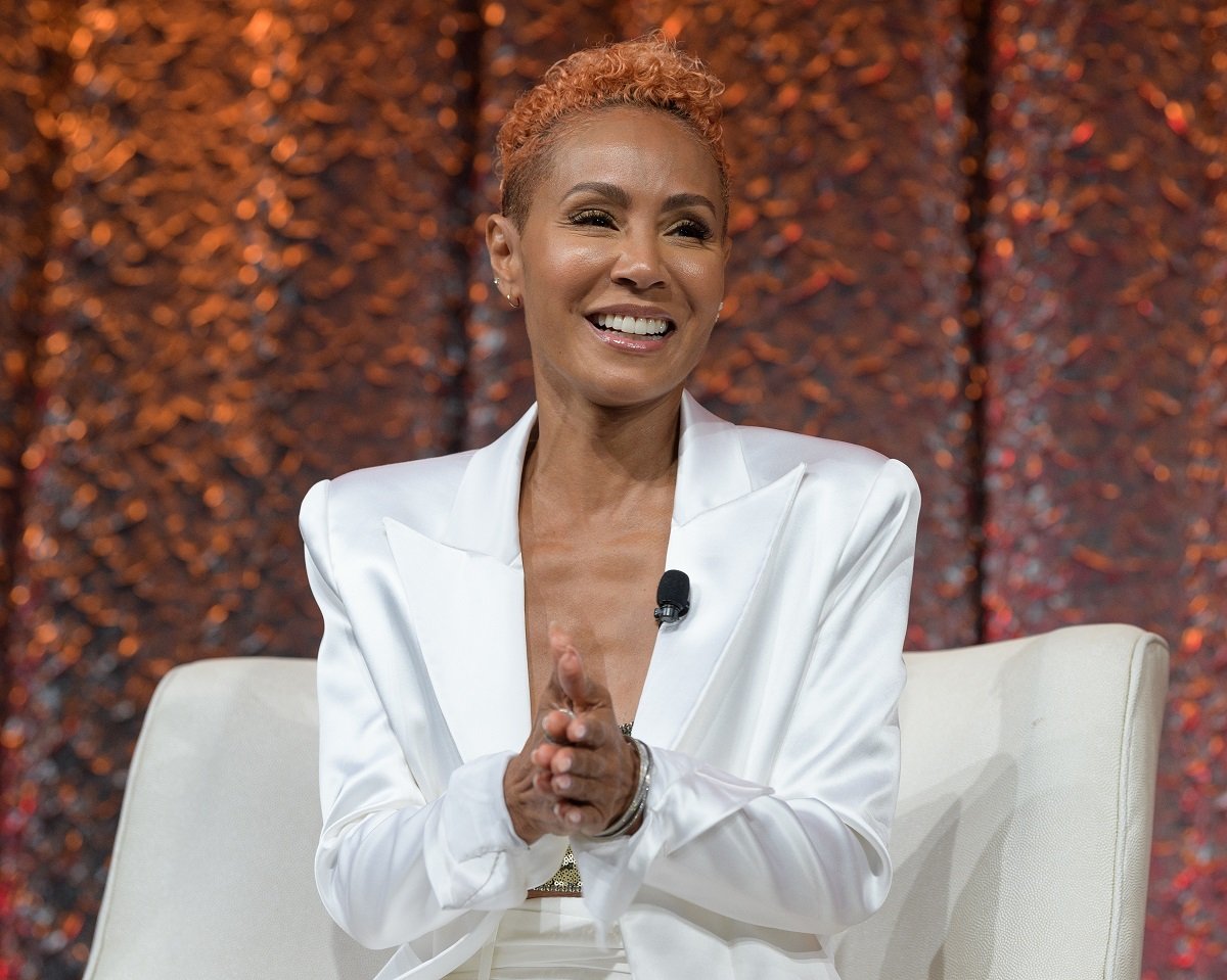 Jada Pinkett Smith smiling in a white dress