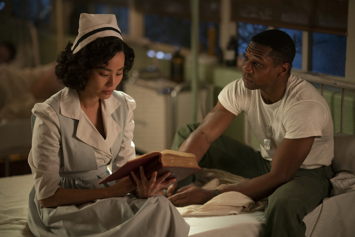 Jamie Chung, and Jonathan Majors sitting in a hospital room in 'Lovecraft Country.'