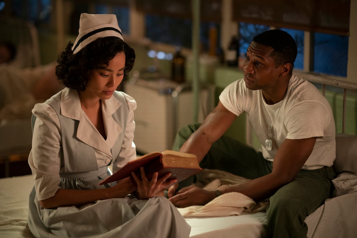 Jamie Chung, and Jonathan Majors sitting in a hospital room in 'Lovecraft Country.'