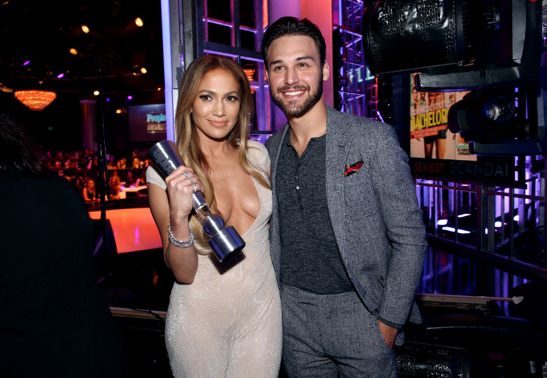 Jennifer Lopez and Ryan Guzman stand next to each other and smile