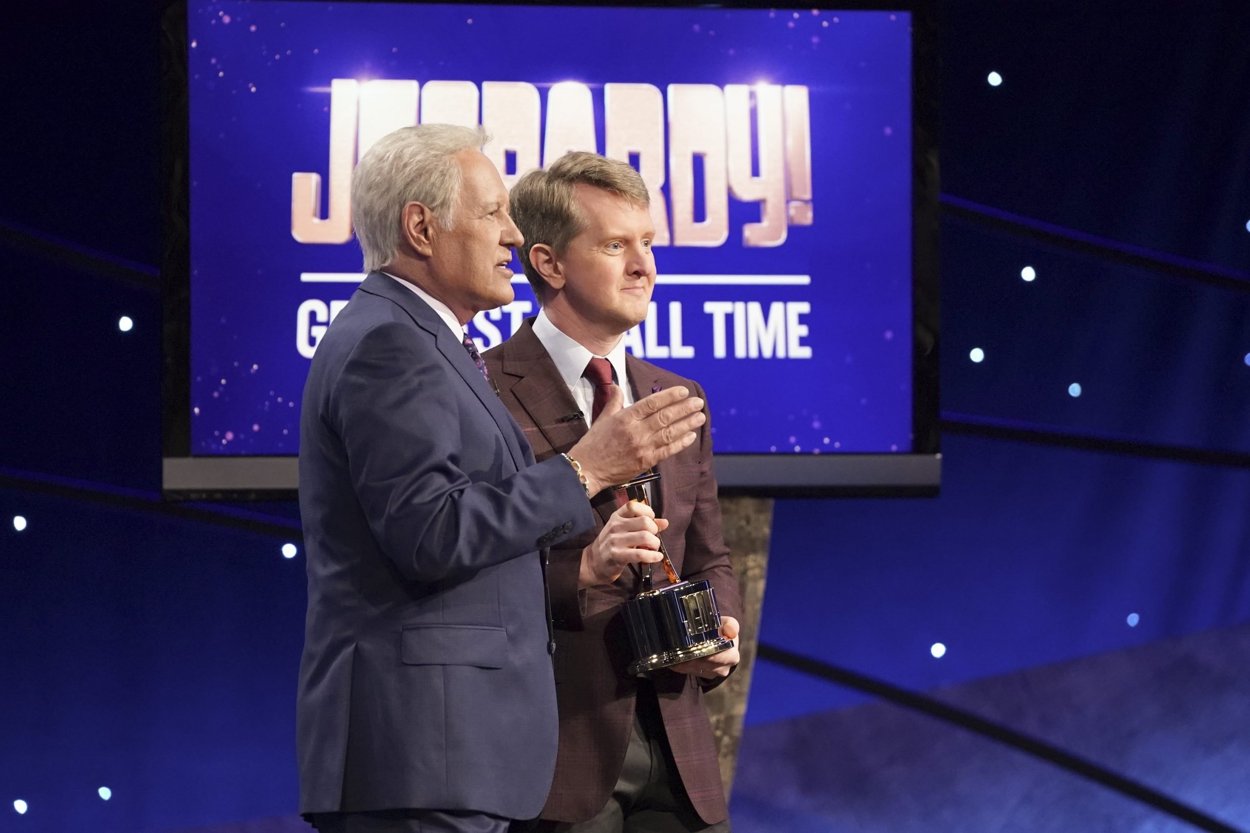 The late Alex Trebek, left, congratulates player Ken Jennings as he's named Greatest of All Time contestant in 2020.