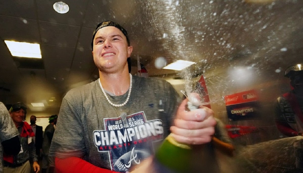 Joc Pederson of the Atlanta Braves celebrates with teammates in the clubhouse after the Braves after win to clinch the 2021 World Series