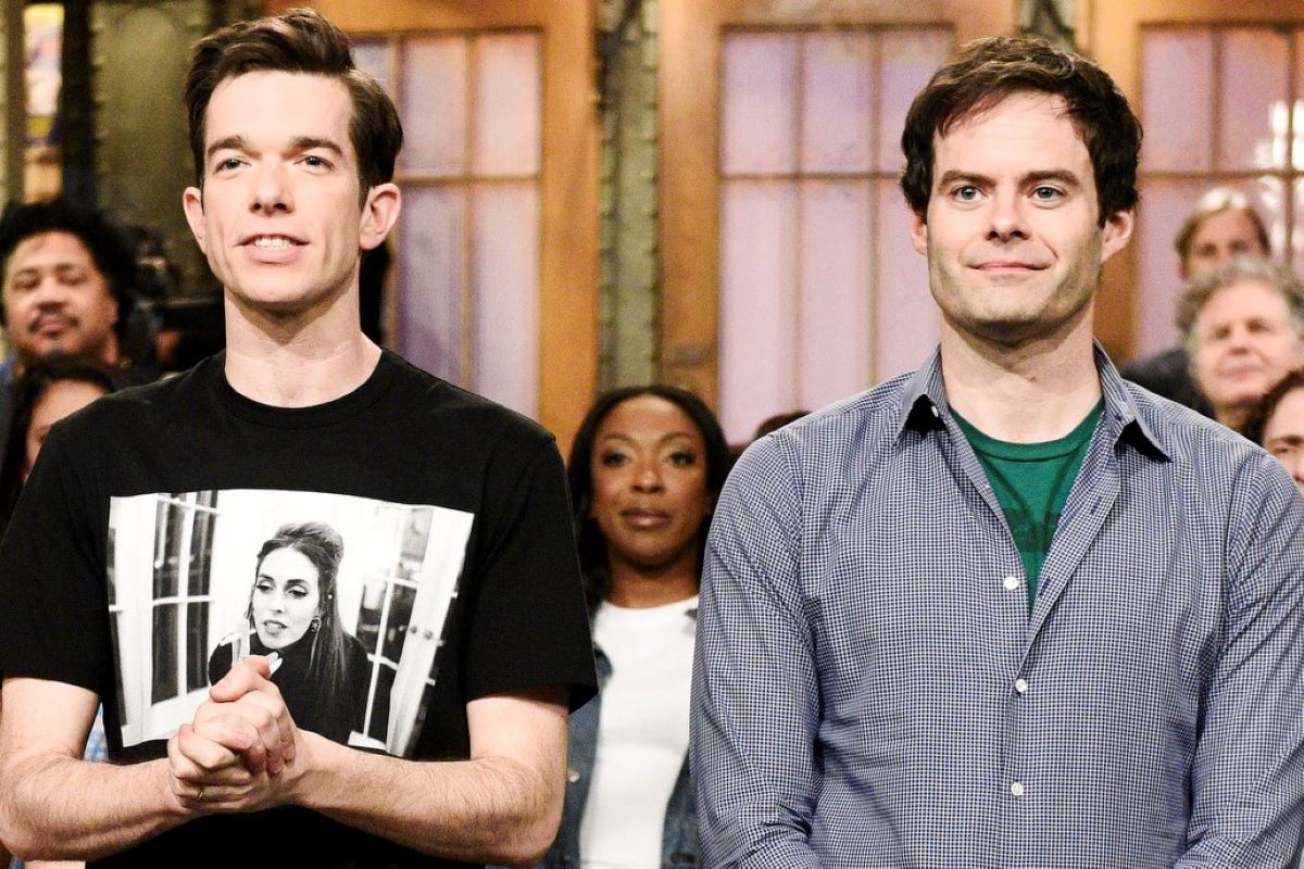 (L) John Mulaney in a t-shirt, (L) Bill Hader in a button down on 'SNL'