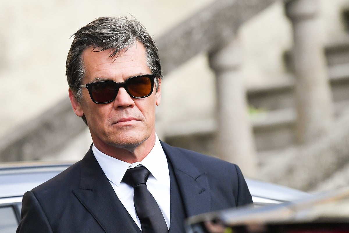 Josh Brolin posing while wearing sunglasses