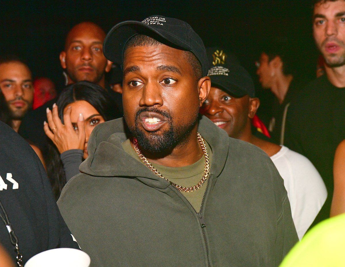 Kanye West wearing a cap.