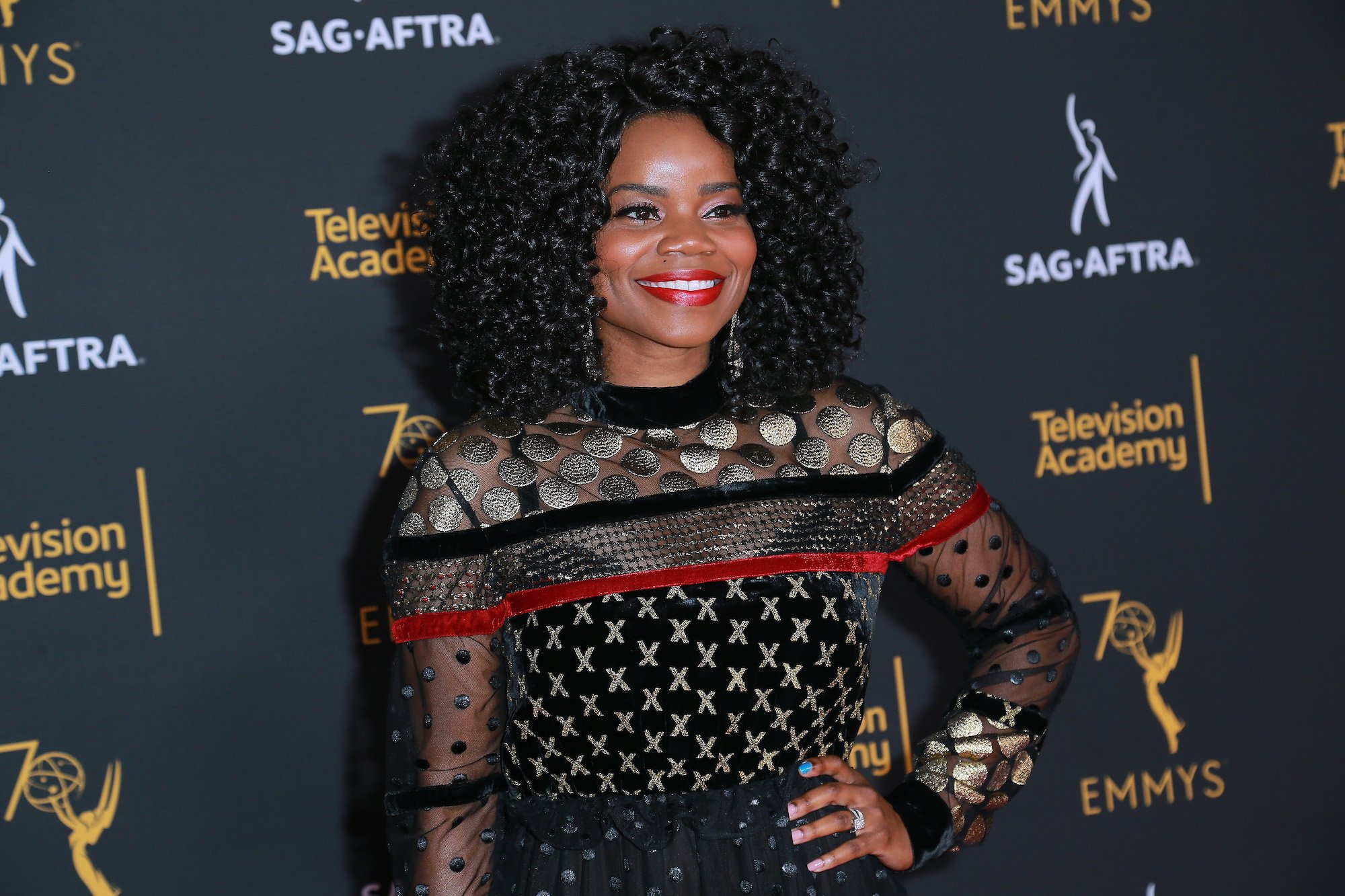 Kelly Jenrette dressed in a black, red and gold dress at the the Television Academy And SAG-AFTRA Co-Host Dynamic & Diverse Emmy Celebration.