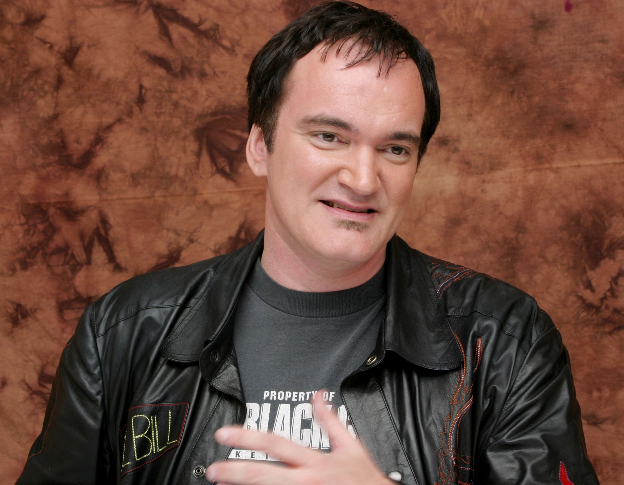 'Kill Bill' filmmaker Quentin Tarantino at a press conference wearing a leather jacket