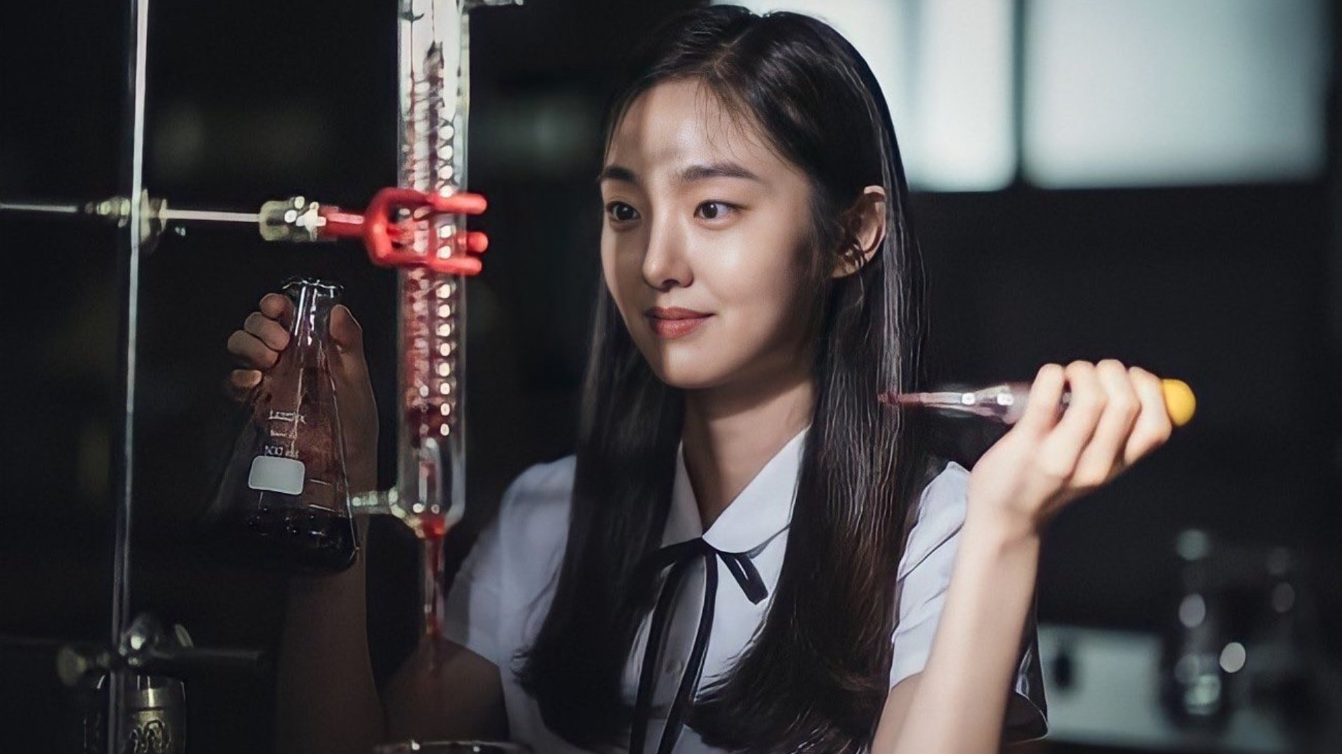 Kim Hye-jun as Song Yi-kyun for Netflix's 'Inspector Koo' K-drama playing with red liquid and science beakers