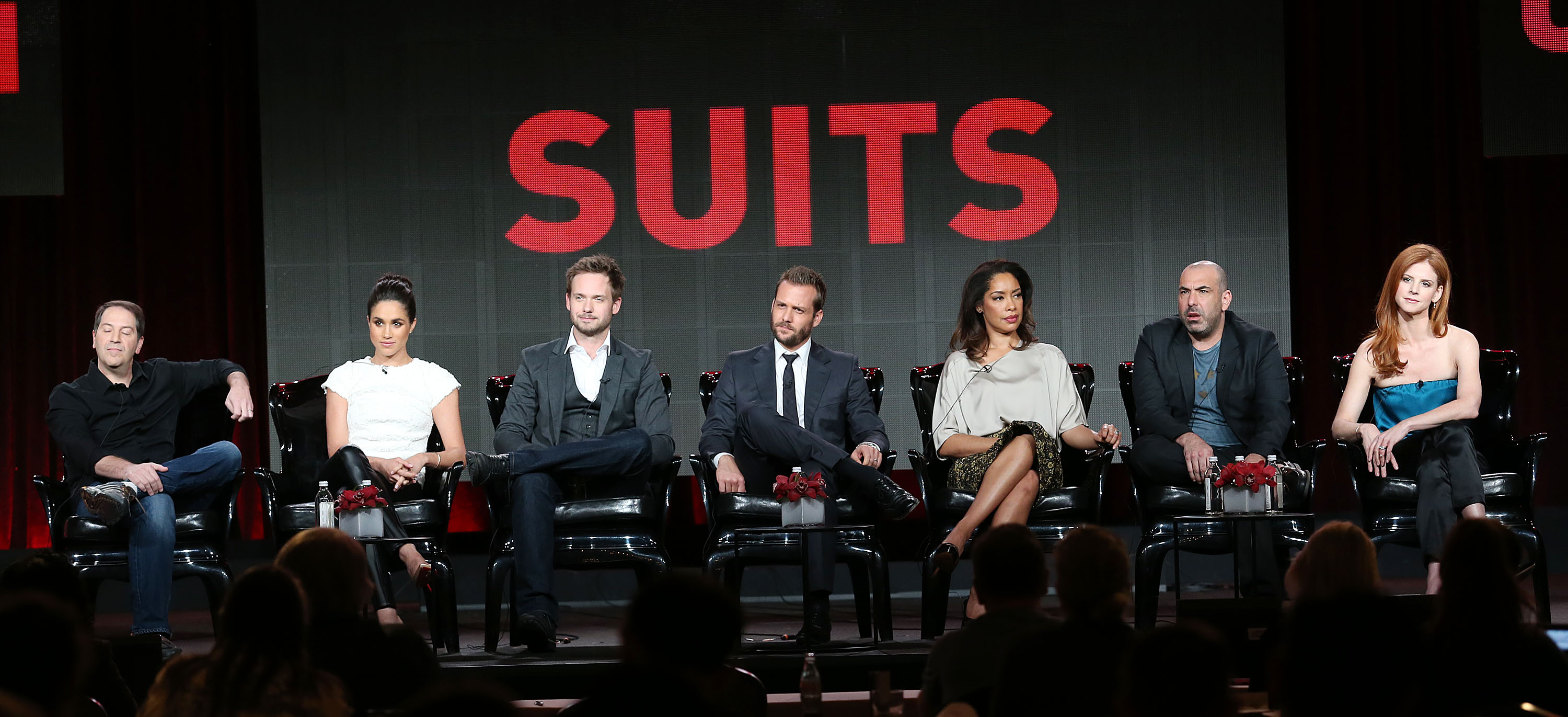(L-R): 'Suits' executive producer Aaron Korsh onstage with Meghan Markle, Patrick J. Adams, Gabriel Macht, Gina Torres, Rick Hoffman, and Sarah Rafferty