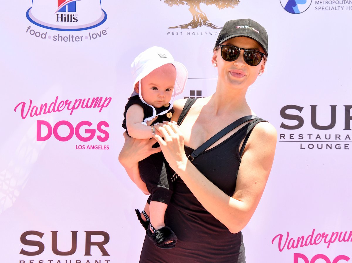 Lala Kent holds baby daughter Ocean at an event.