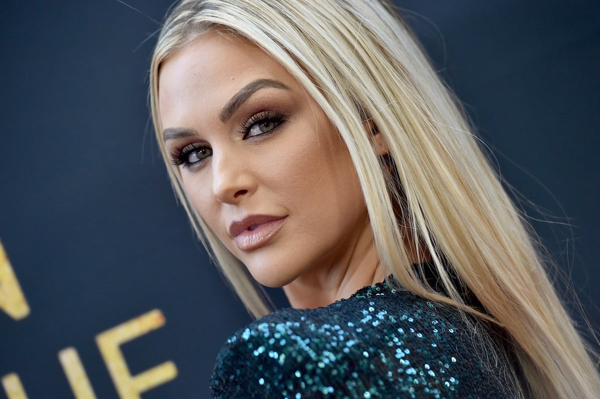 Lala Kent looks over her shoulder at the camera.