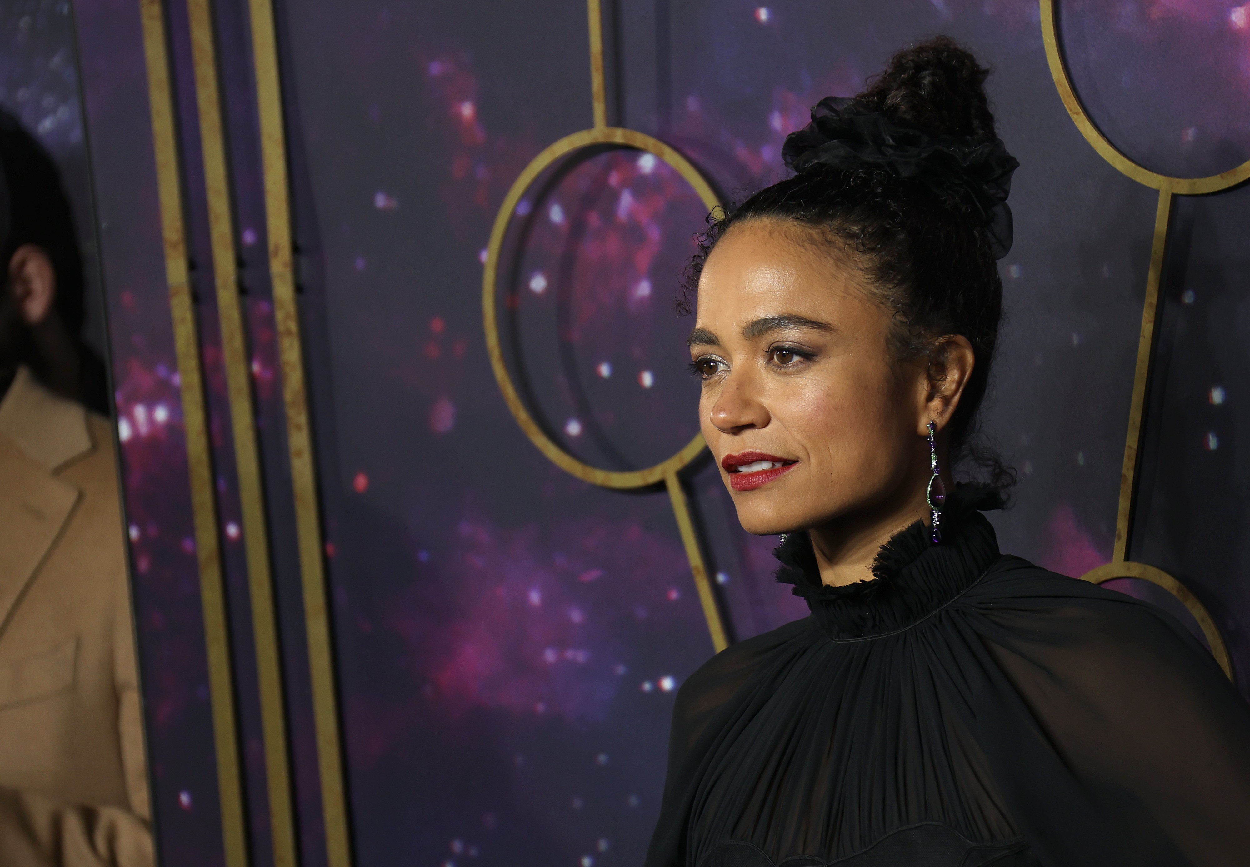 Marvel's 'Eternals' star Lauren Ridloff wears a black long-sleeved turtleneck dress.