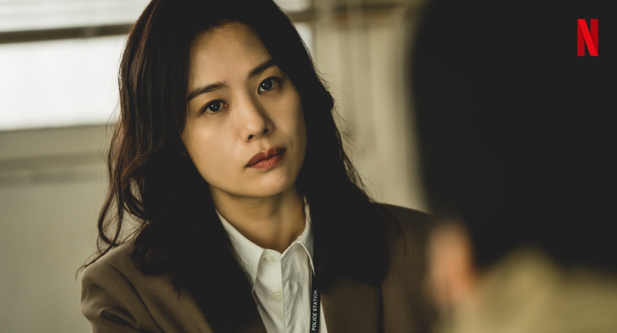 Main character Min Hye-jin from Netflix's 'Hellbound' wearing brown blazer.