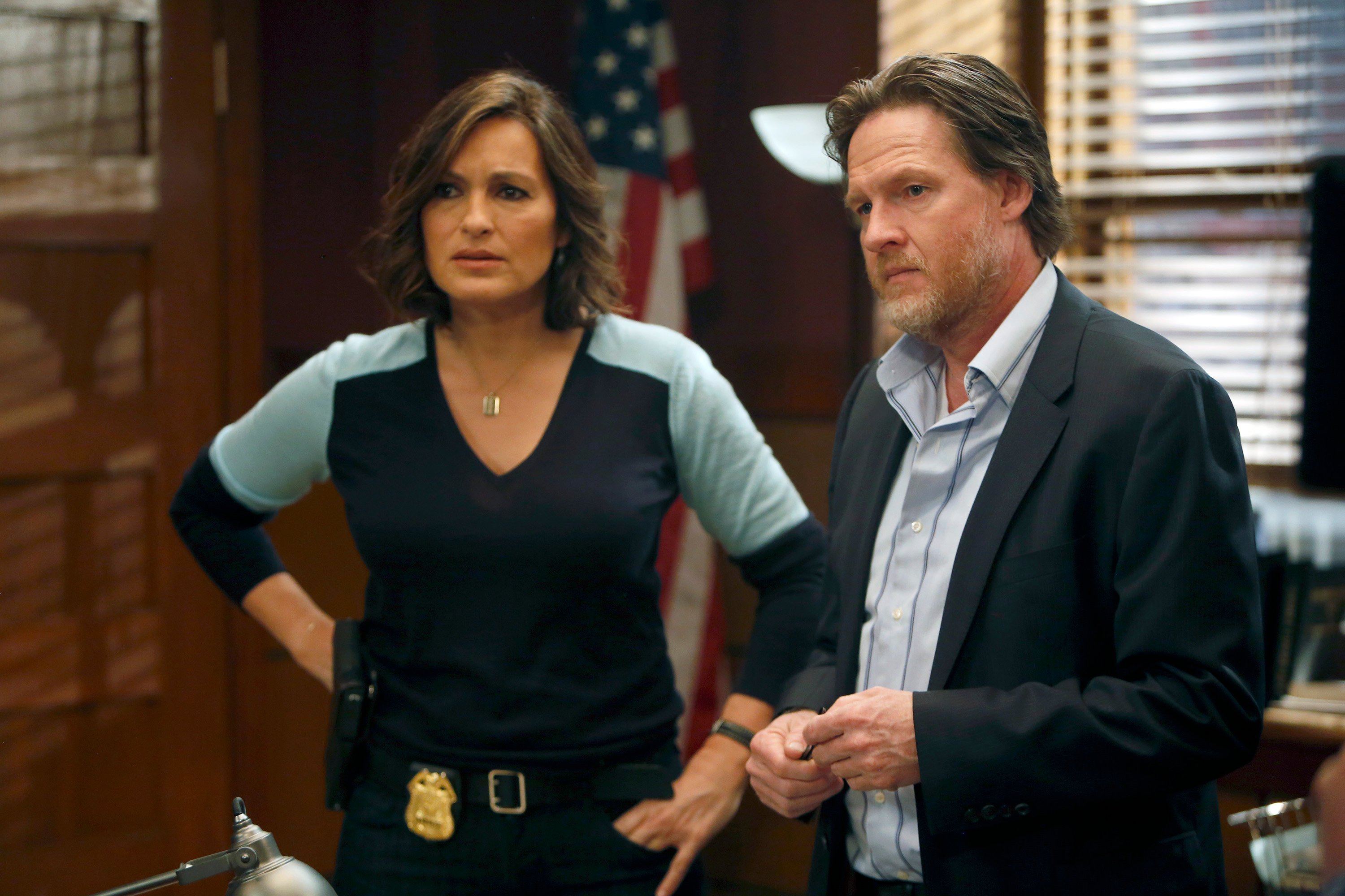 Mariska Hargitay, with her hands on her hips, standing next to Donal Logue in an episode of 'Law & Order: SVU'