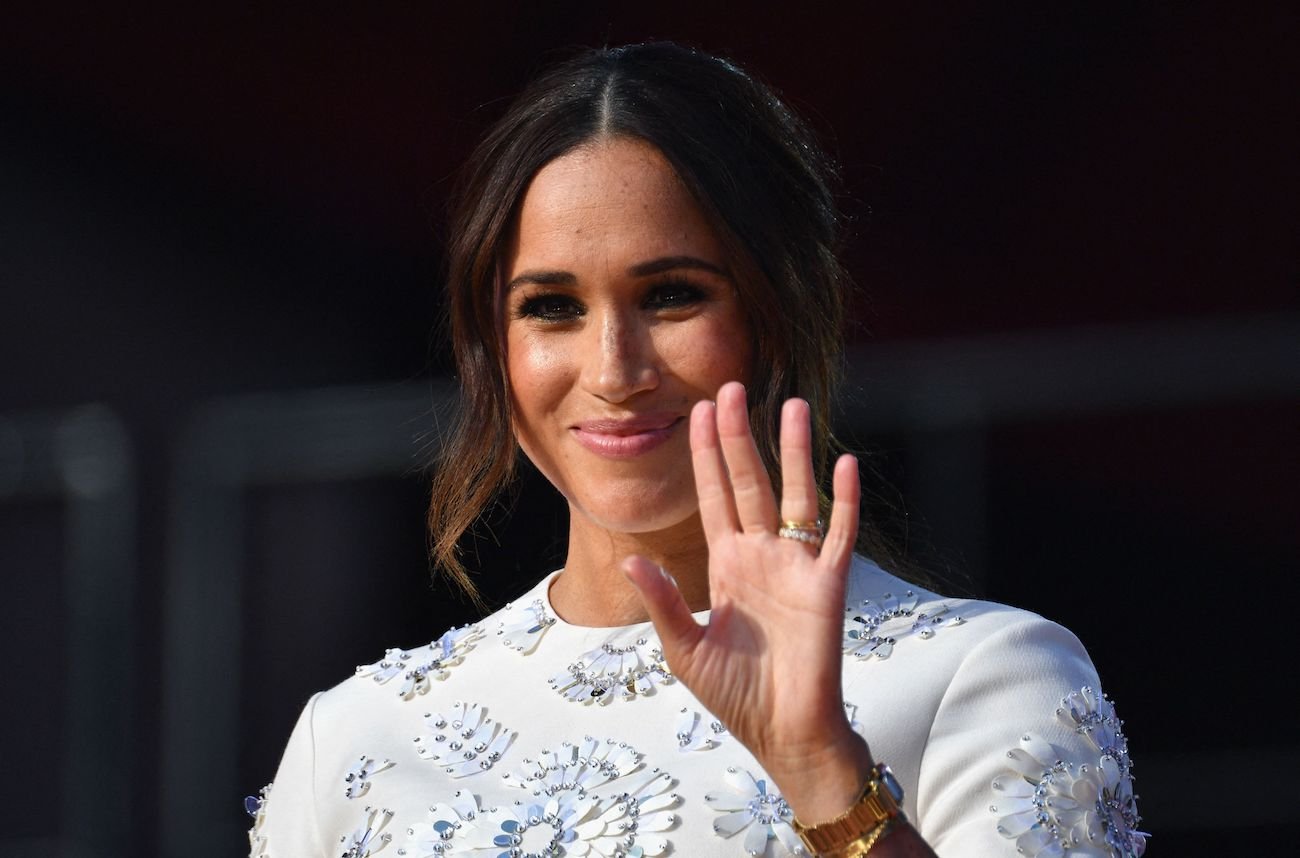 Meghan Markle showing palm of her hand on stage at Global Citizen Live