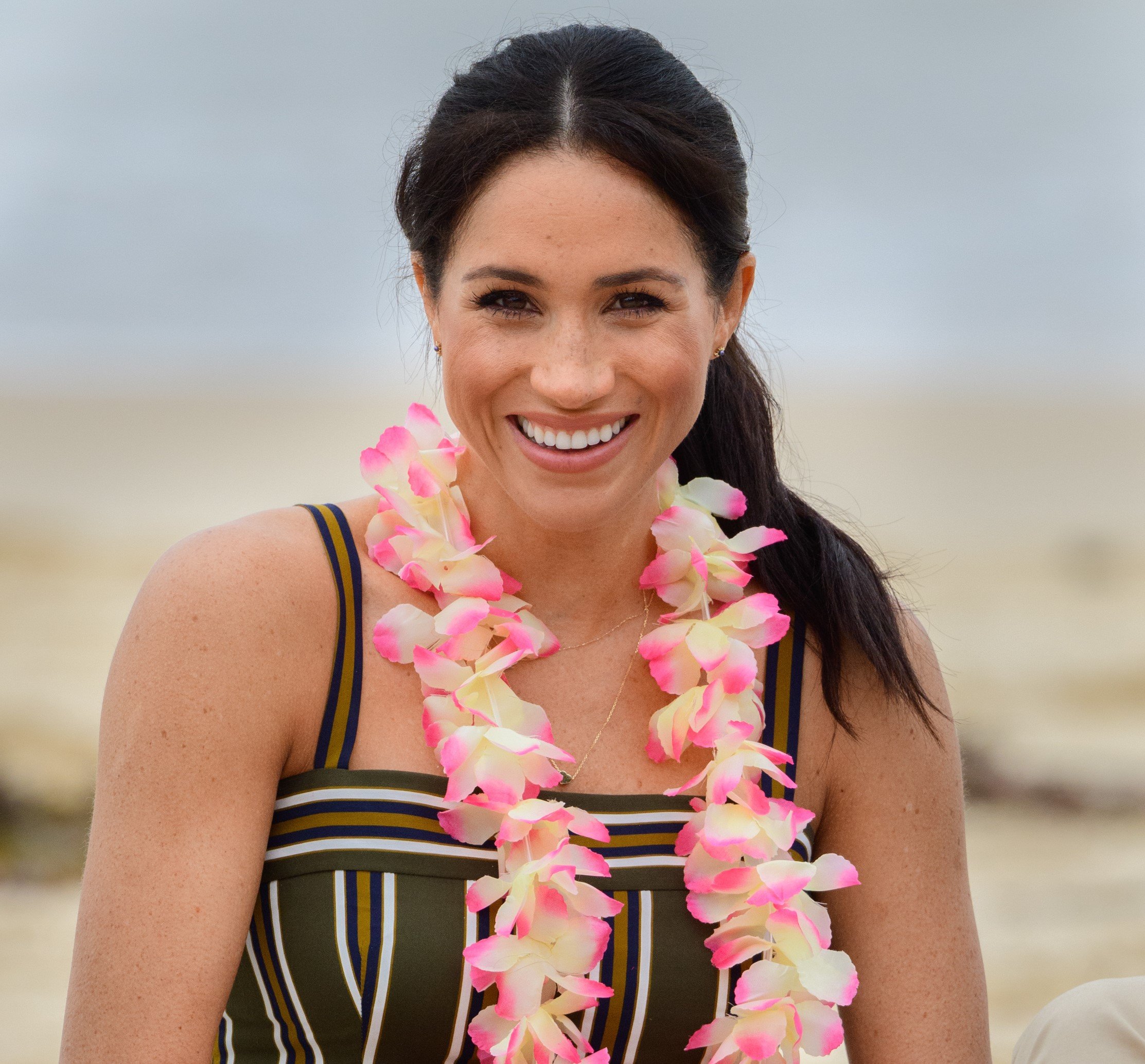 Meghan Markle smiling during visit to Bondi beach in Sydney, Australia