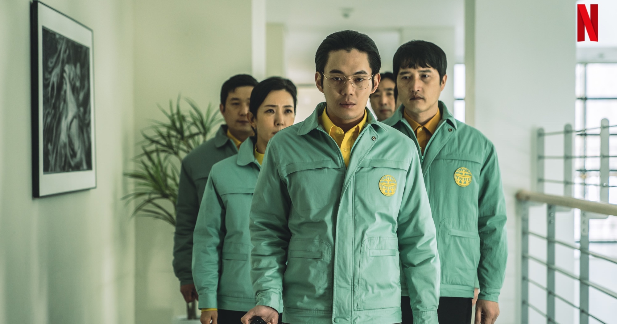 Members of the New Truth Society in 'Hellbound' K-drama wearing green jackets.