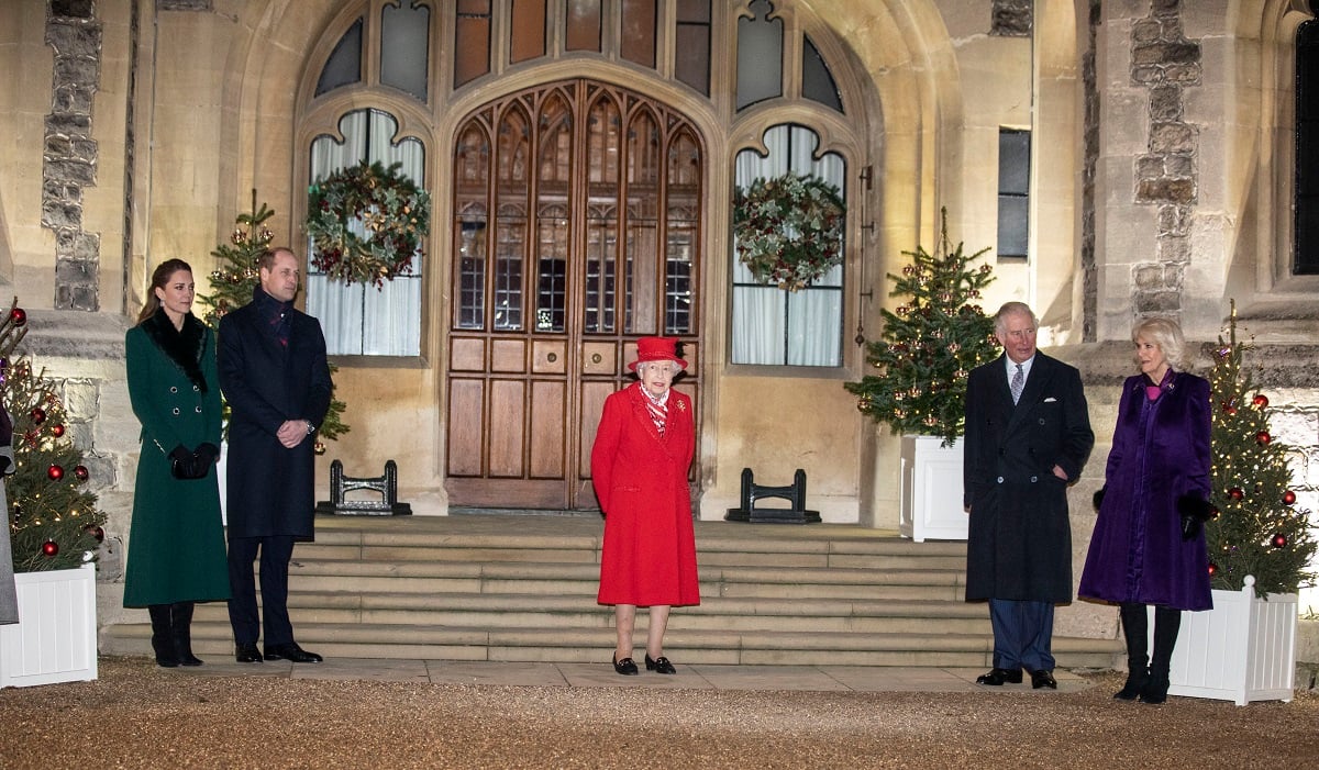 Members of the royal family standing outside Windsor Castle thanking volunteers for their work during the pandemic