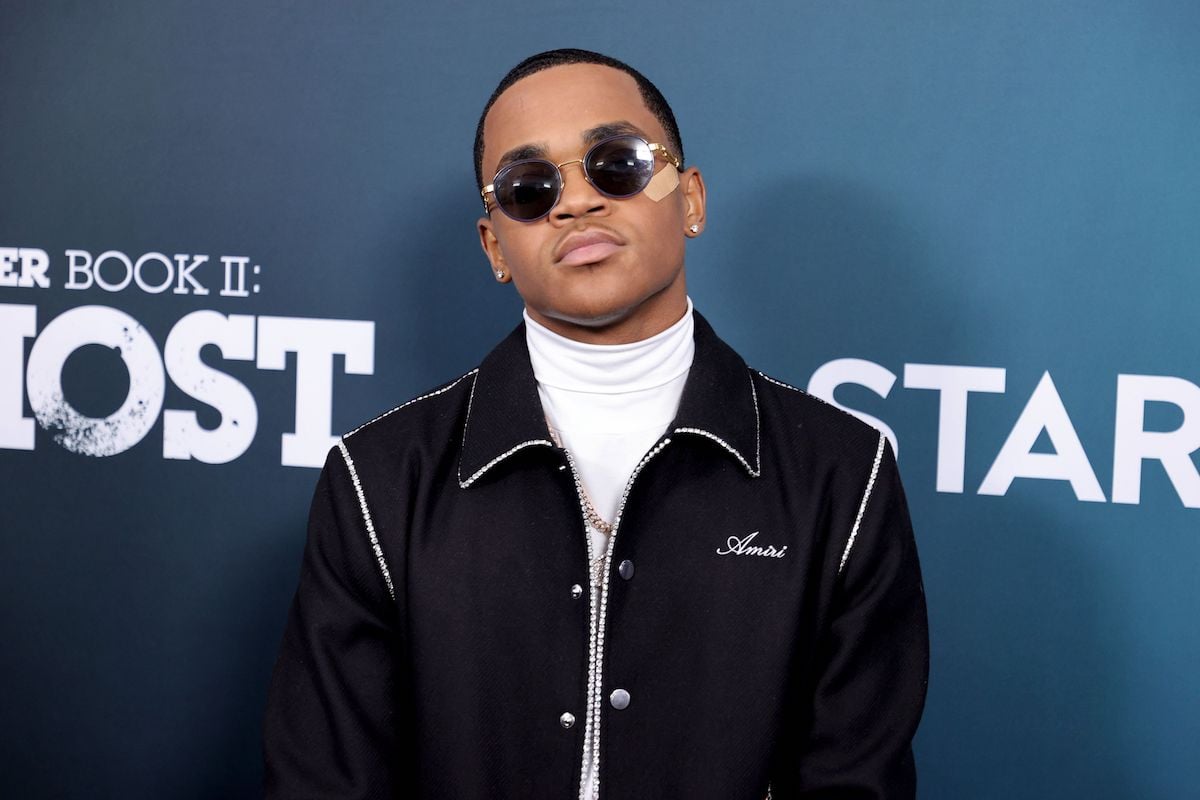 Michael Rainey Jr. attends the "Power Book II: Ghost" Season 2 premiere wearing a black jacket and a bandaid on his face