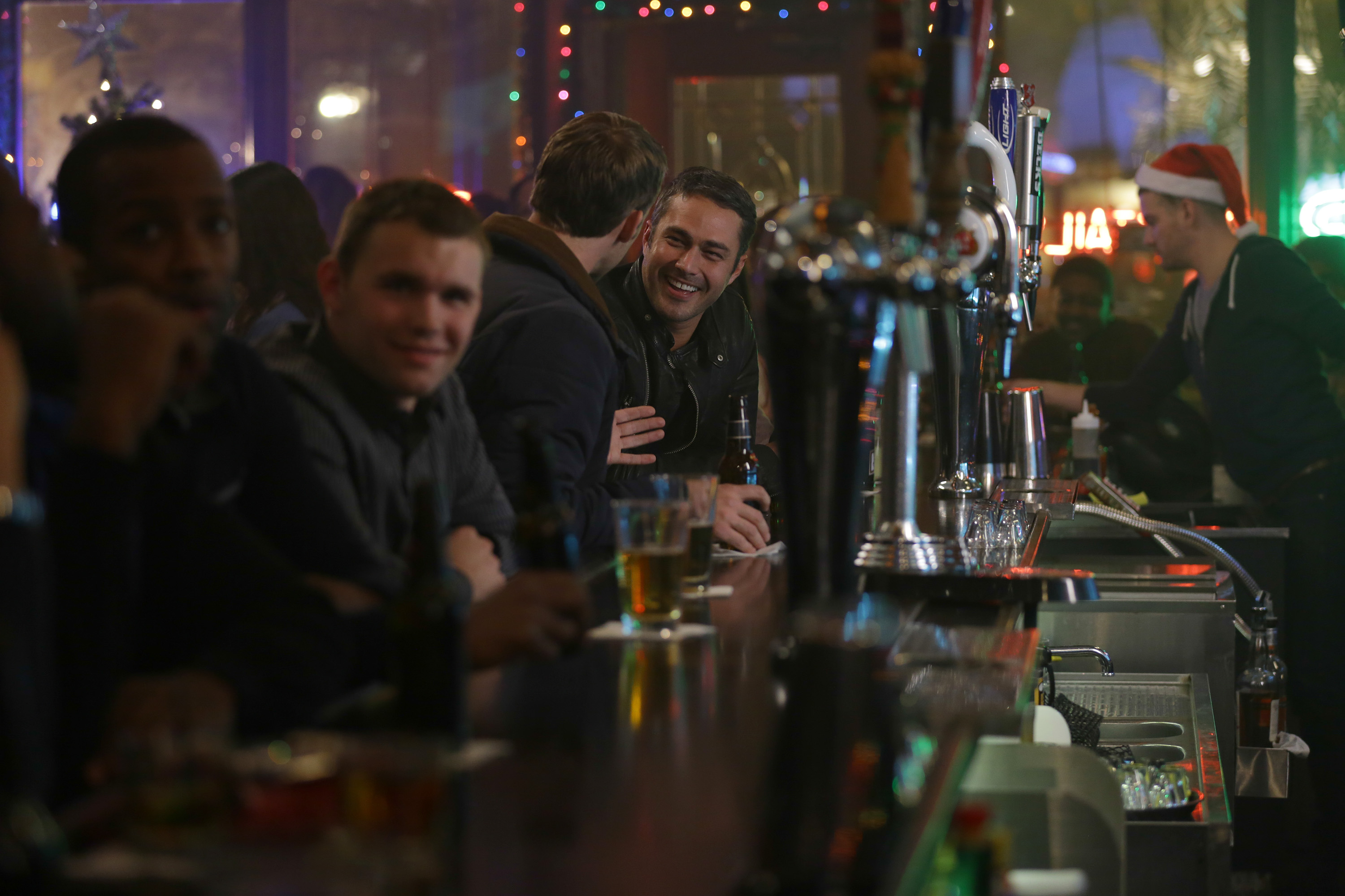 Patrons at Molly's Bar at Christmastime in 'Chicago Fire' Season 3