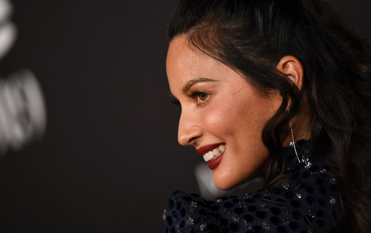 Close-up of Olivia Munn from the side, smiling