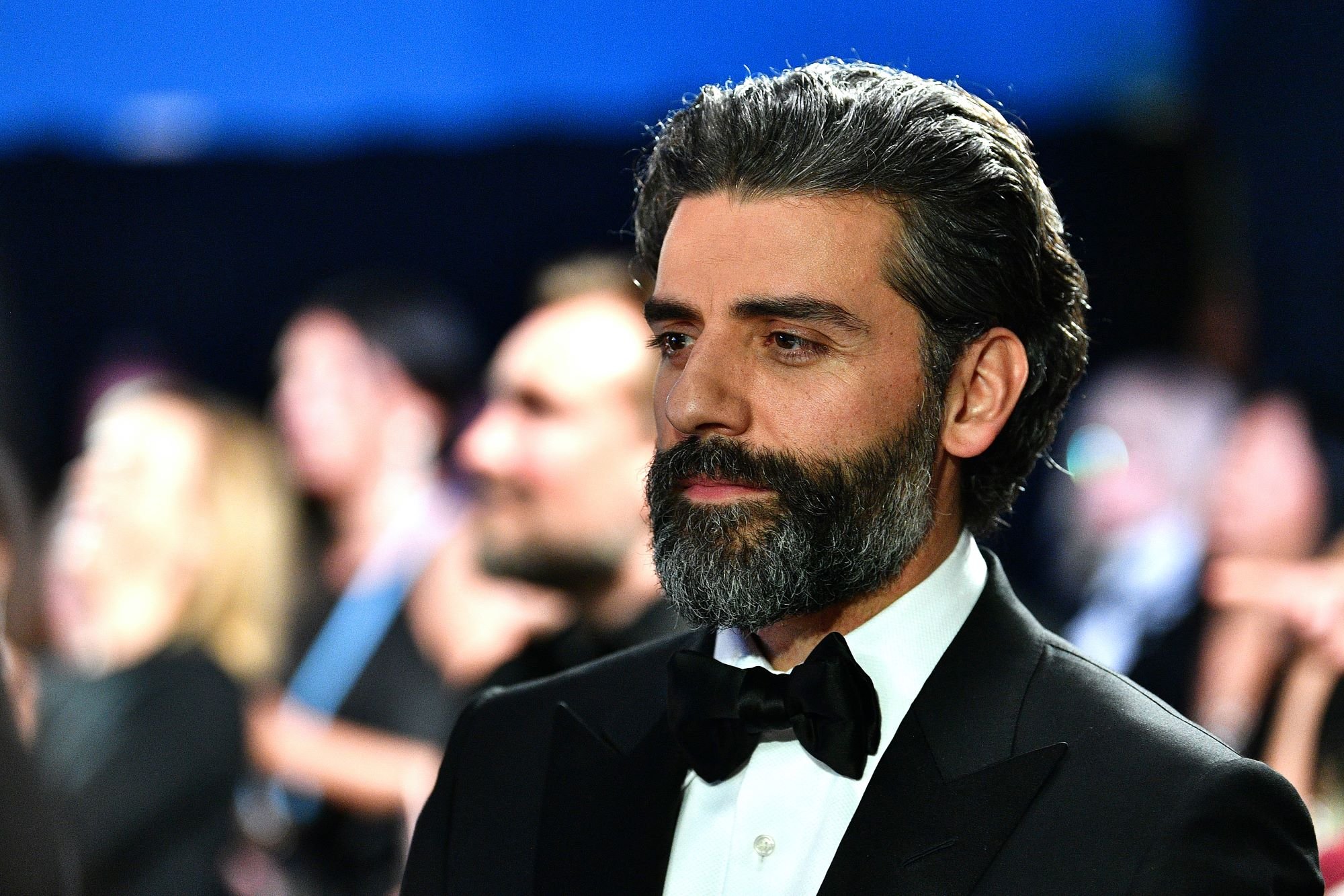 'Moon Knight' star Oscar Isaac wears a black suit over a white shirt and a black bow tie.