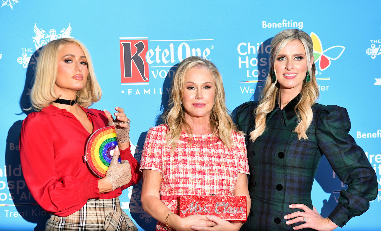 Paris Hilton, Kathy Hilton, and Nicky Hilton Rothschild pose together on the red carpet