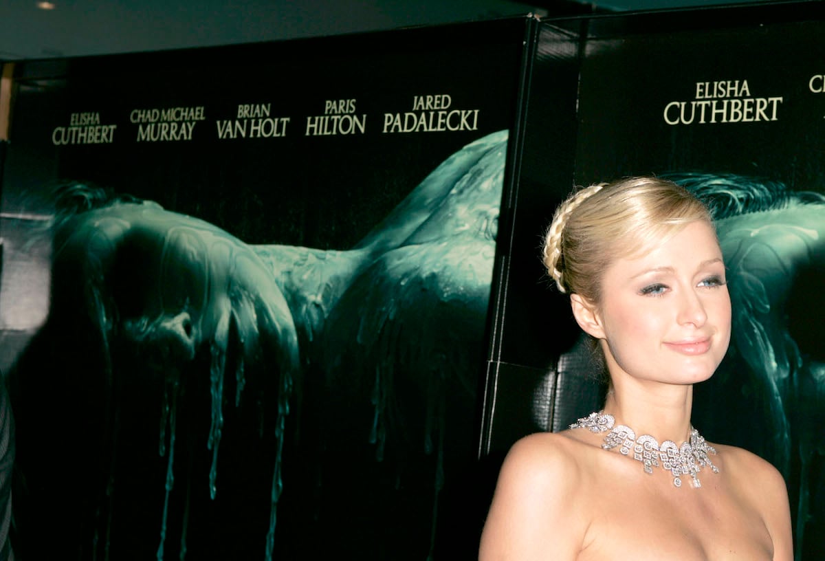 Paris Hilton on the red carpet for 2005 'House of Wax' movie with large necklace