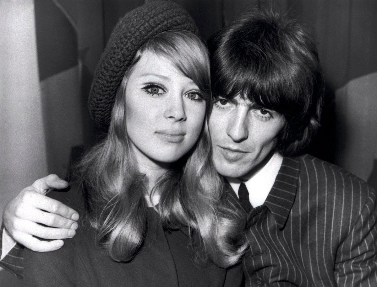 Pattie Boyd and George Harrison smile for the camera.