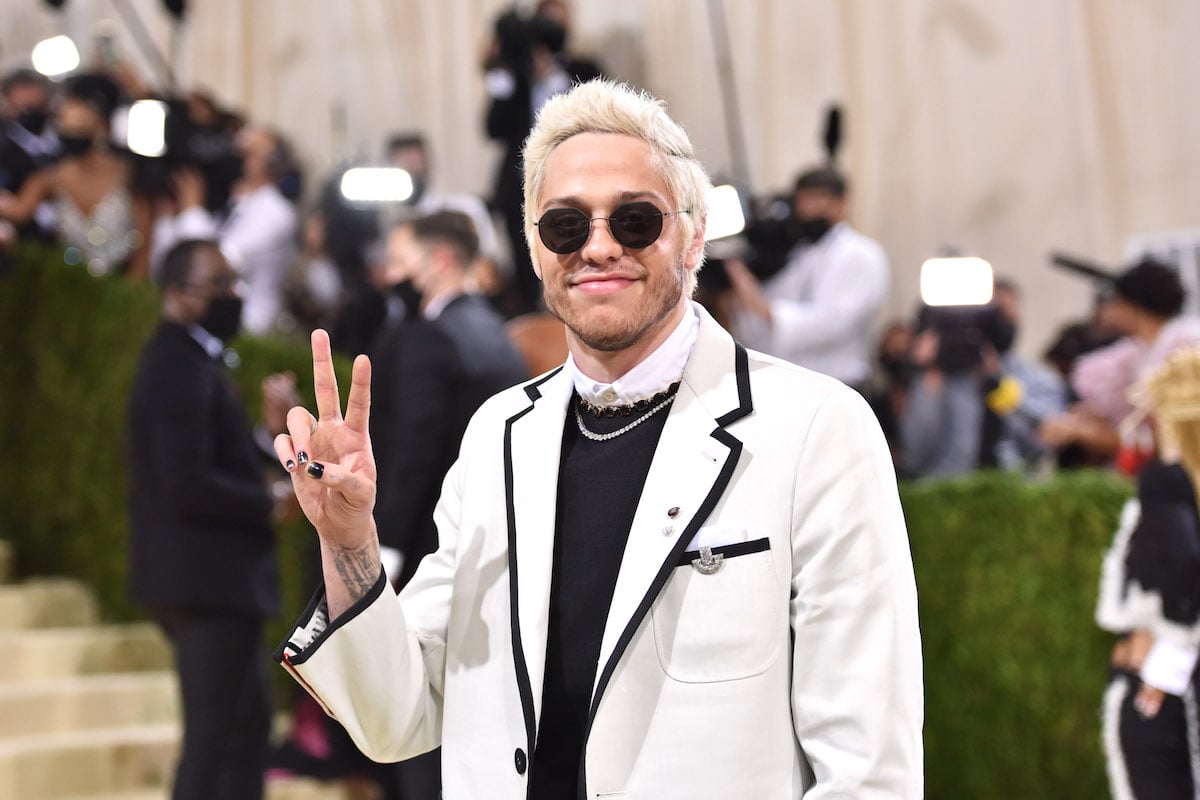 Pete Davidson flashes a peace sign at the 2021 Met Gala.