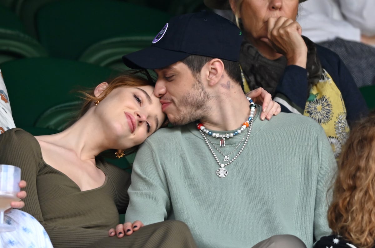 Phoebe Dynevor and Pete Davidson kiss and cuddle at Wimbledon.