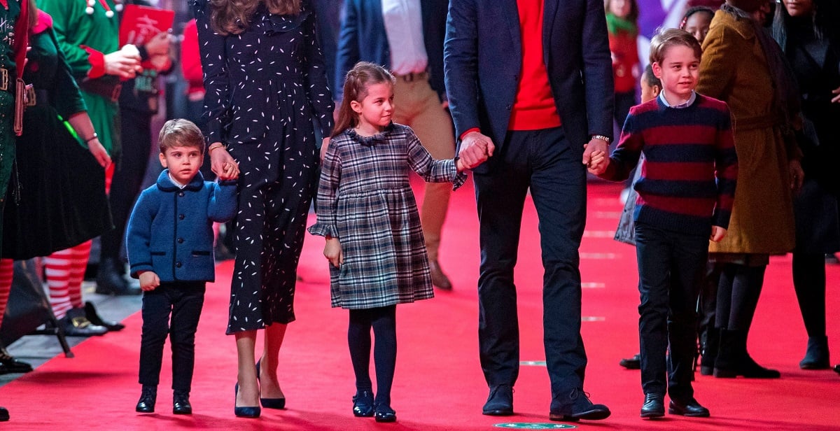 Prince Louis, Princess Charlotte, and Prince George, walking on the carpet before special pantomime performance at London's Palladium Theatre