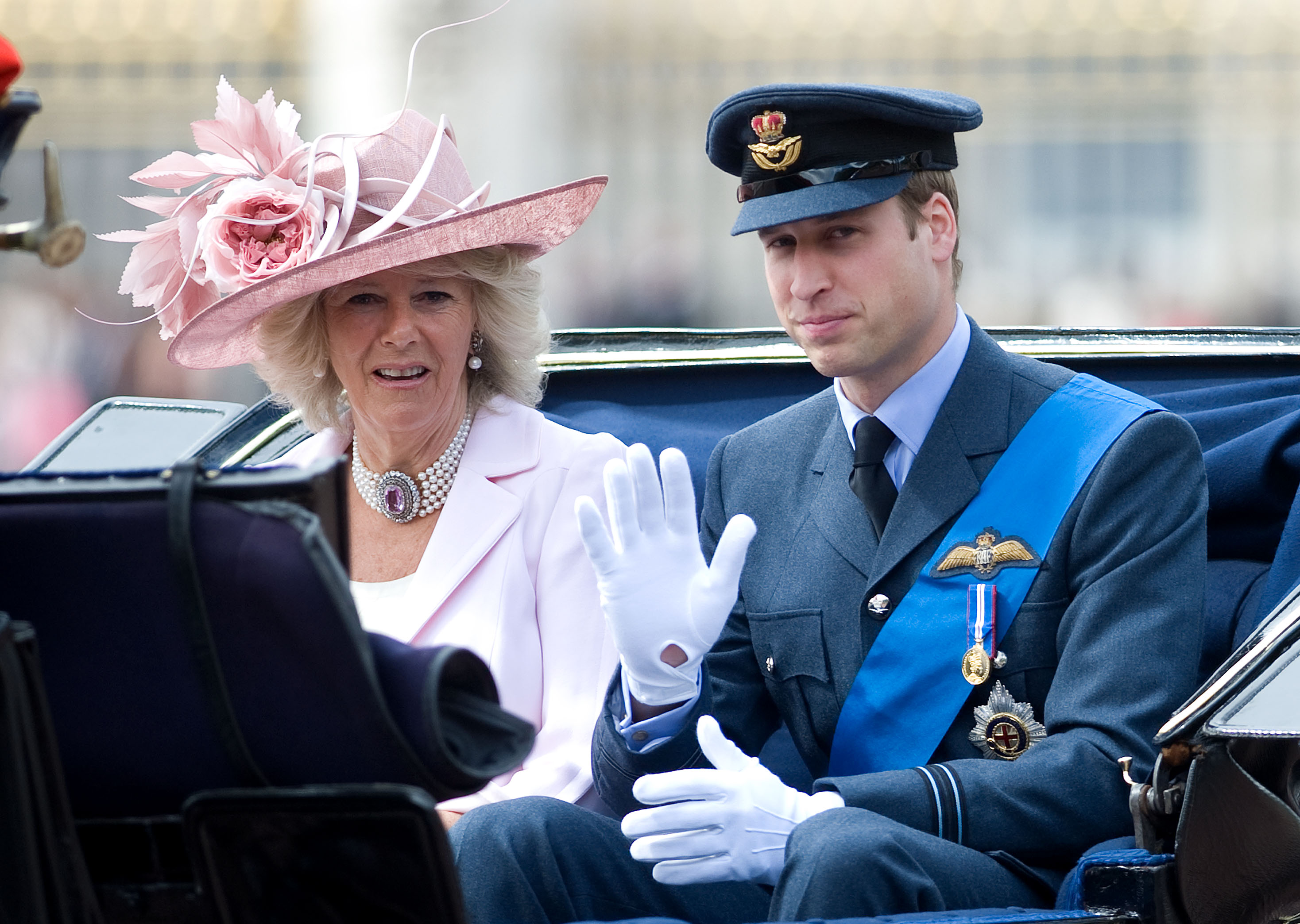 Prince William and Camilla Parker Bowles riding in a carriage during Trooping The Colour