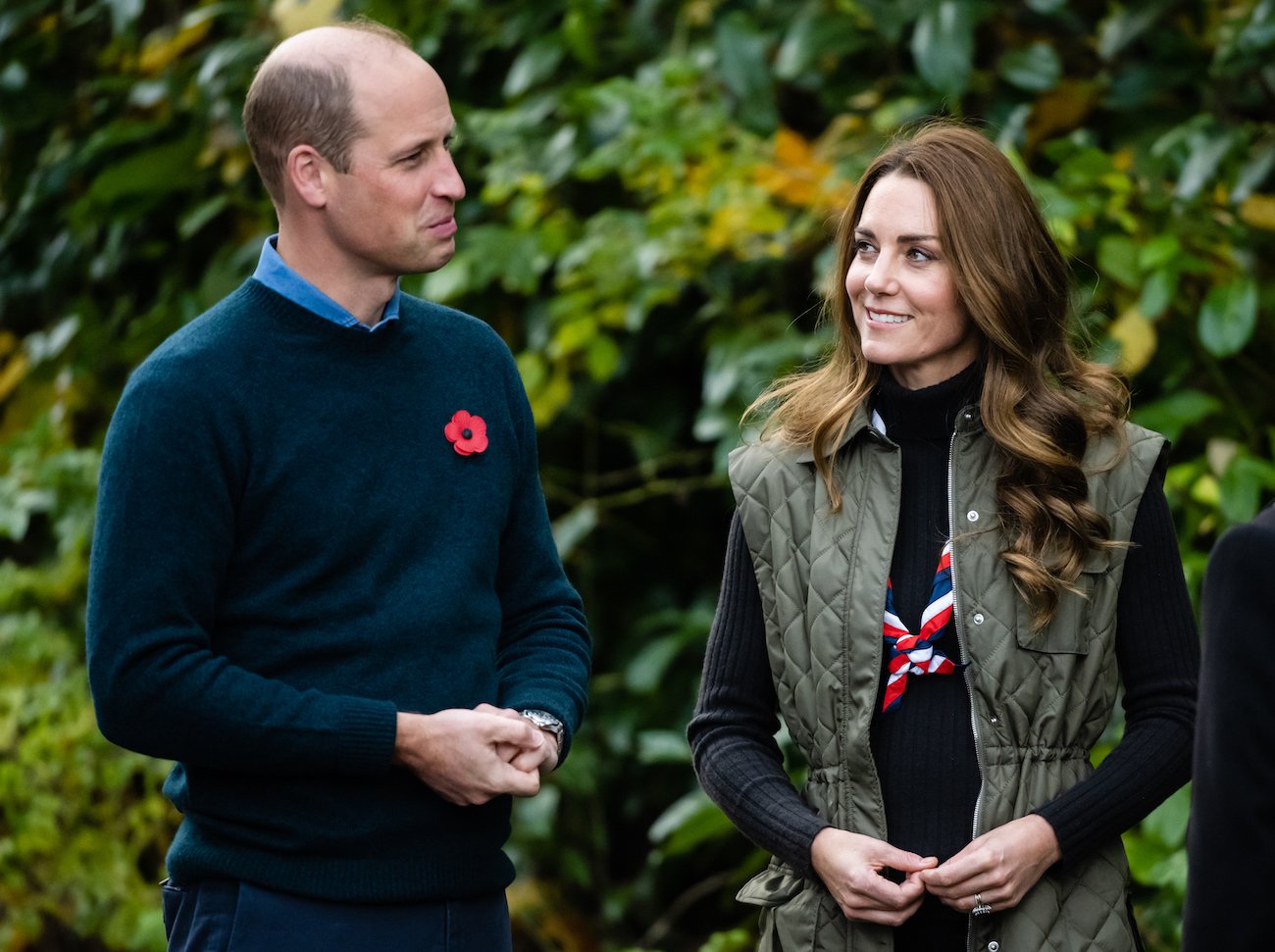 Kate Middleton smiles at Prince William as he looks on