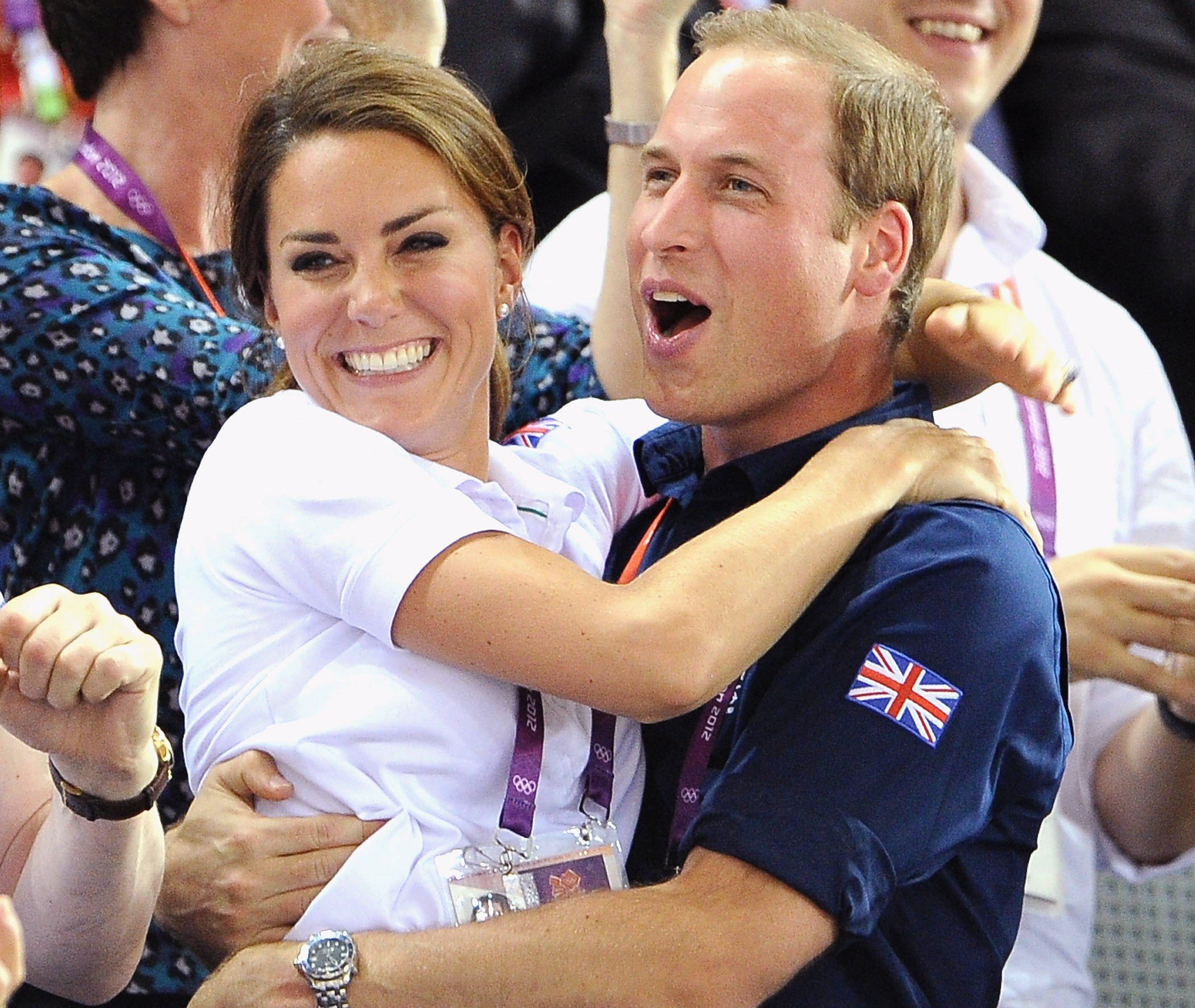 Prince William and Kate Middleton cheering and hugging during Day 6 of the London 2012 Olympic Games