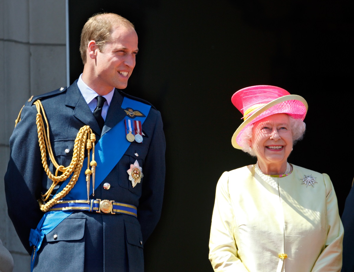 Prince William and Queen Elizabeth II watch a flypast from Buckingham Palace balcony