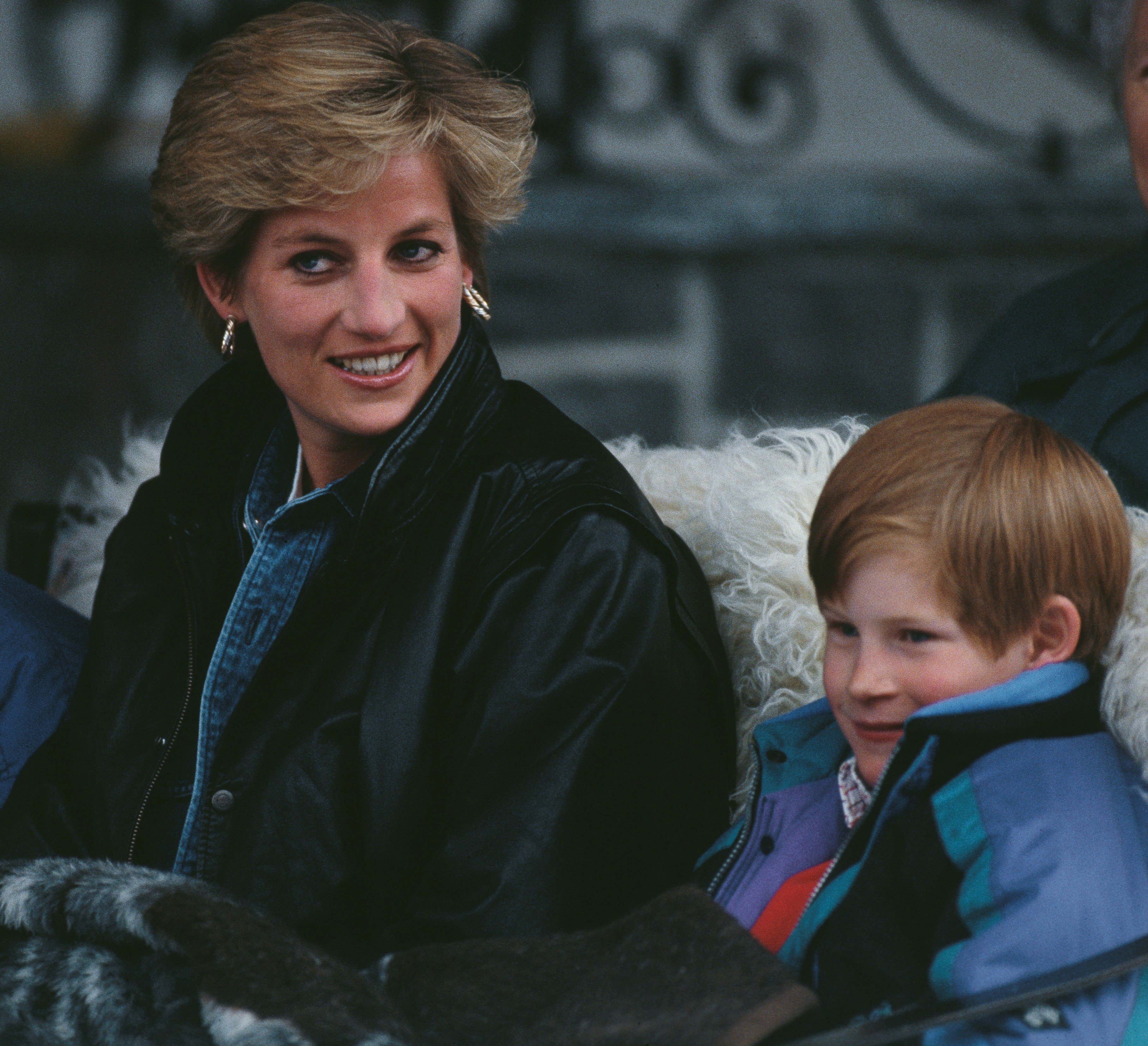 Princess Diana and Prince Harry on a sleigh during a skiing holiday in Lech, Austria