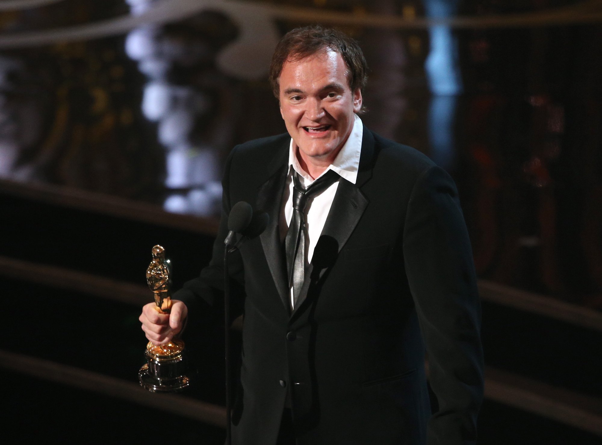 'Pulp Fiction' filmmaker Quentin Tarantino accepting the best writing Oscar for 'Django Unchained'