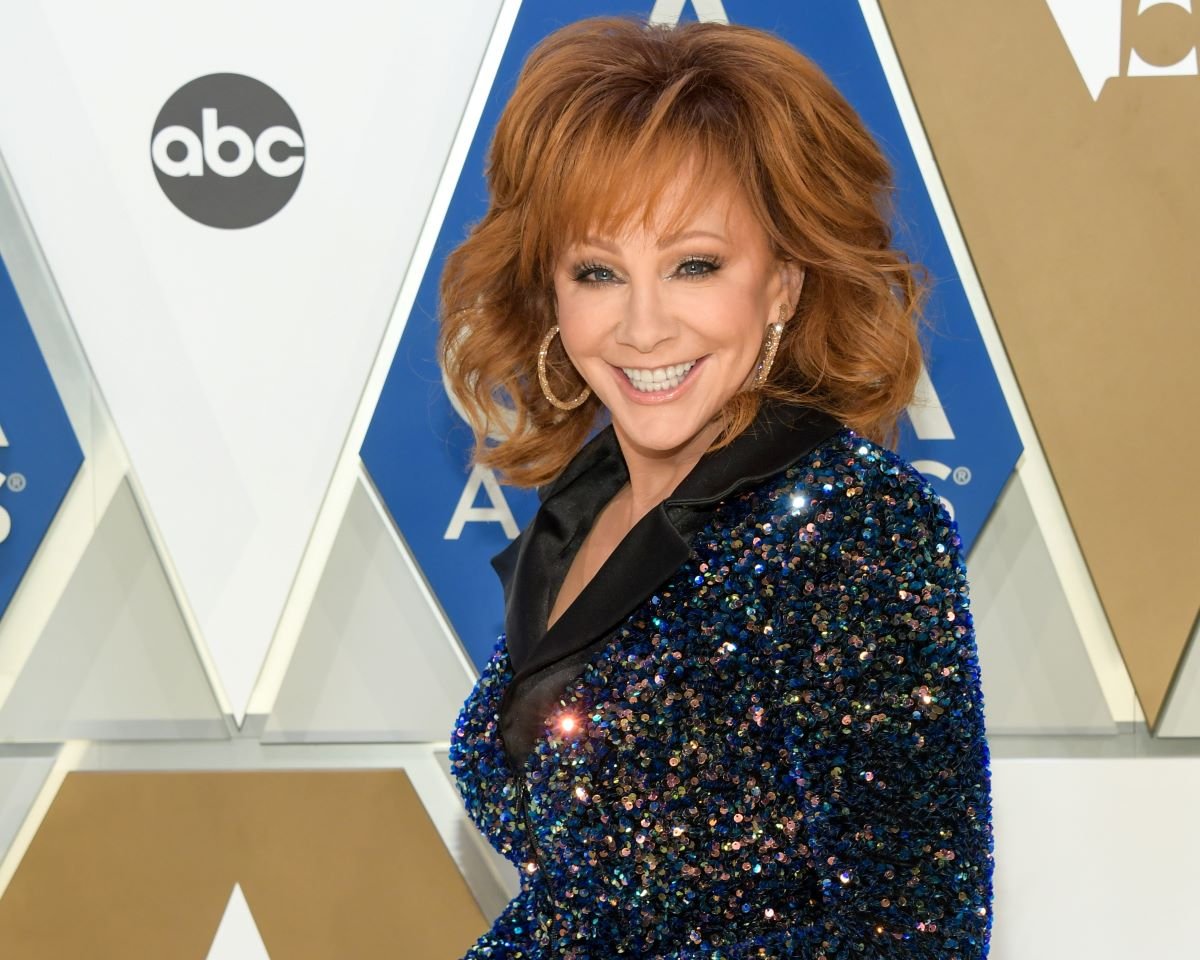 Reba McEntire in a sparkly top, smiling