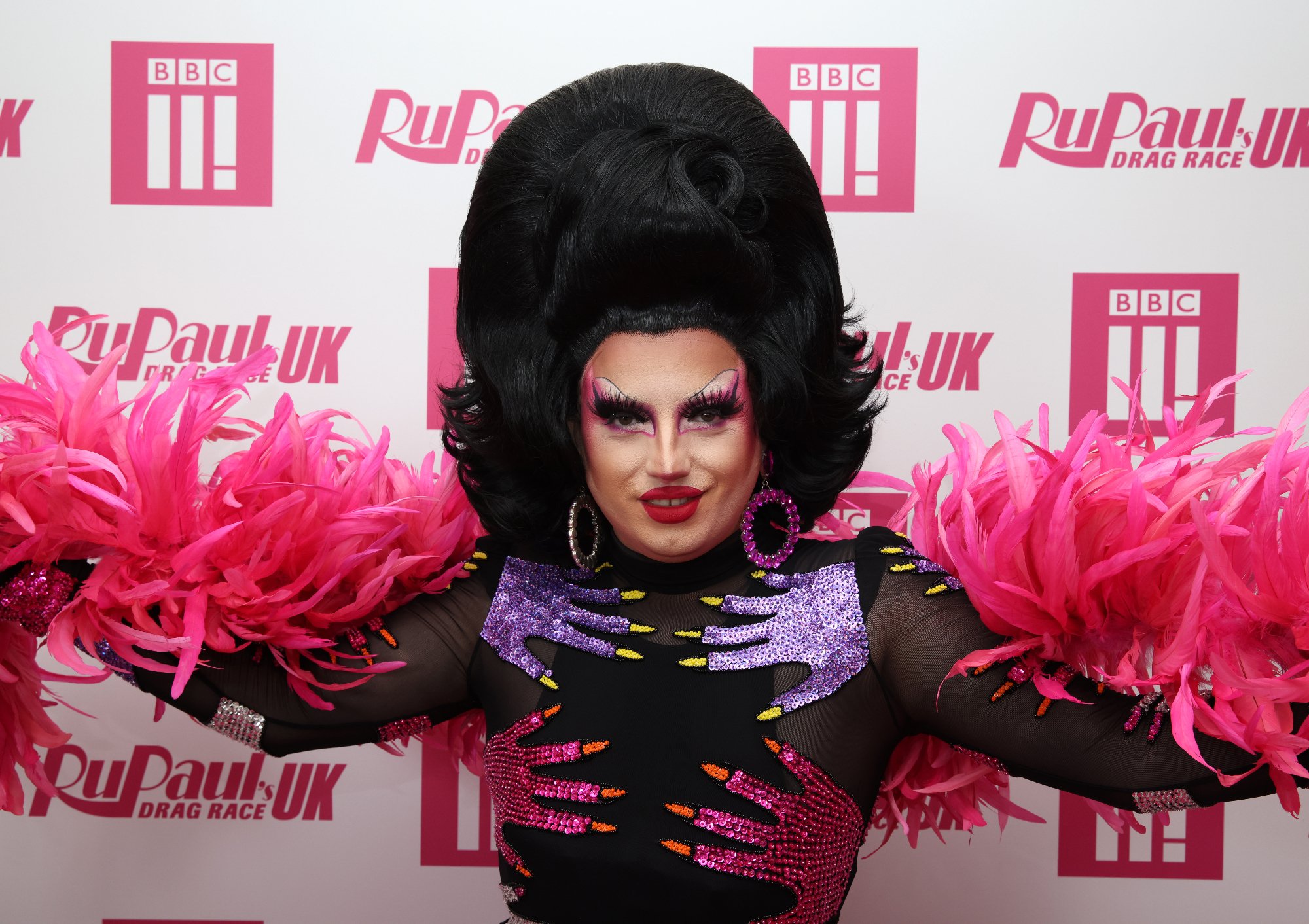 'RuPaul's Drag Race UK' Season 3 drag queen Choriza May with pink feathers