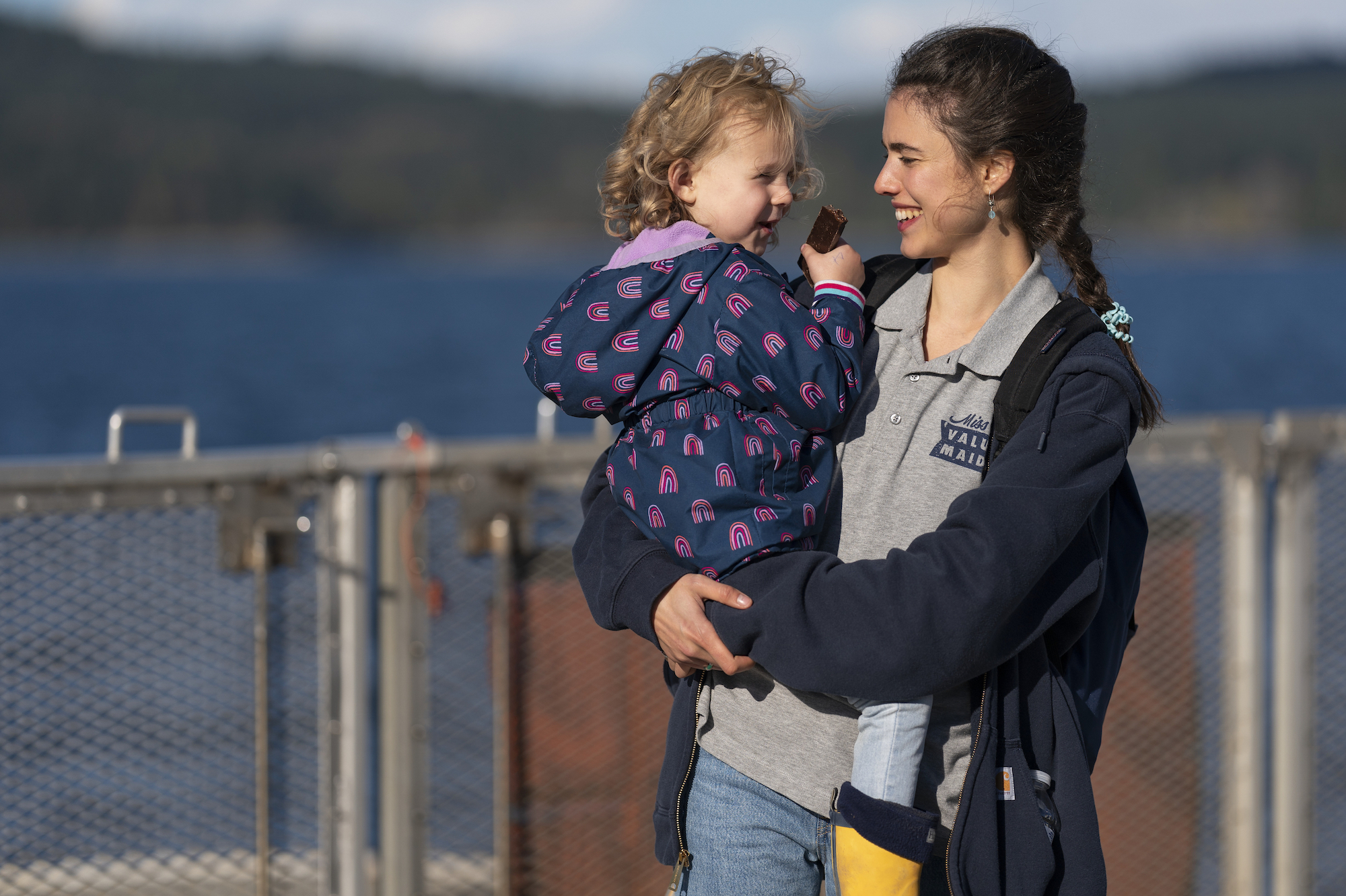 Rylea Nevaeh and Margaret Qualley standing near a lake in 'Maid' Season 1.