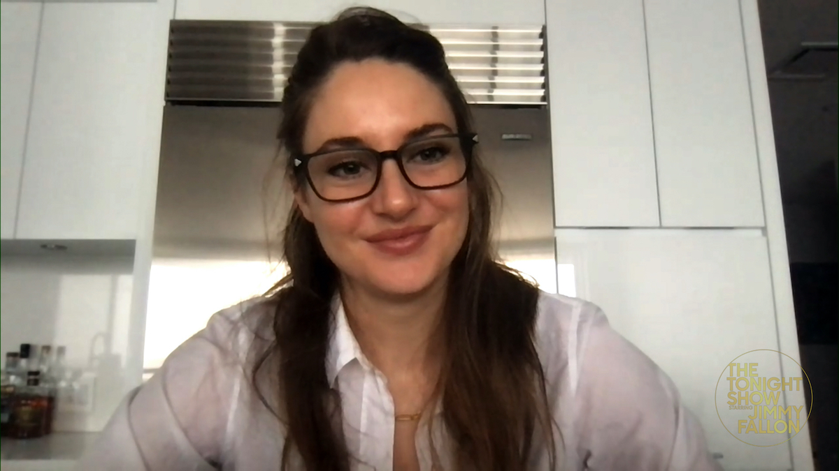 Shailene Woodley in black glasses and a white top