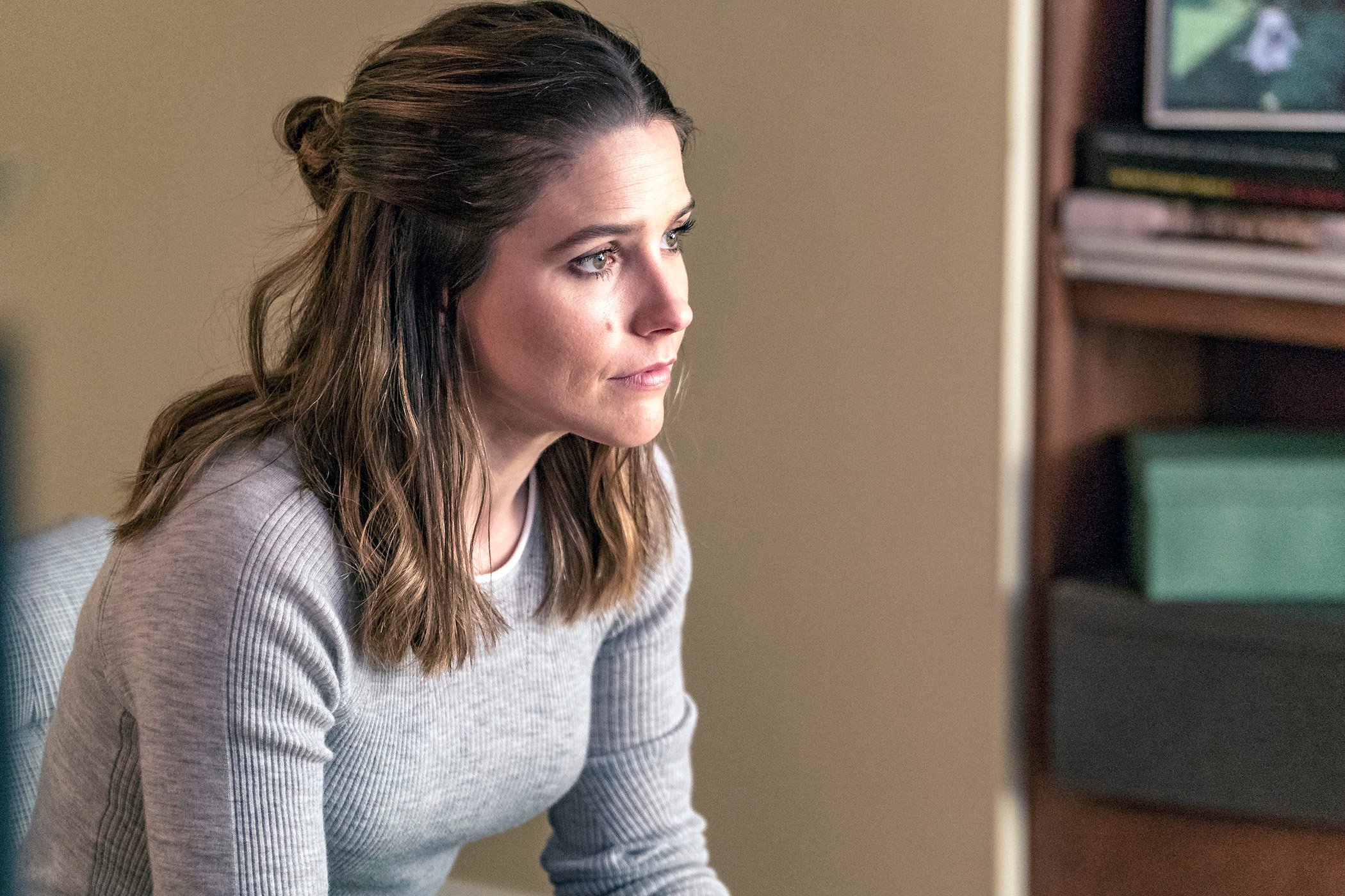 Sophia Bush as Erin Lindsay in 'Chicago P.D.' sitting and looking serious. Sophia Bush stars in 'Good Sam' premiering in 2022 at the same time as 'Chicago P.D.' Season 9.