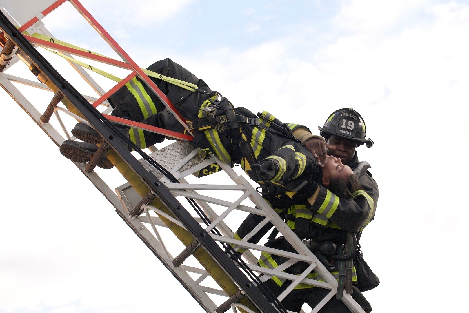 'Station 19' Okieriete Onaodowan and Barrett Doss on a ladder portraying Dean Miller and Vic Hughes