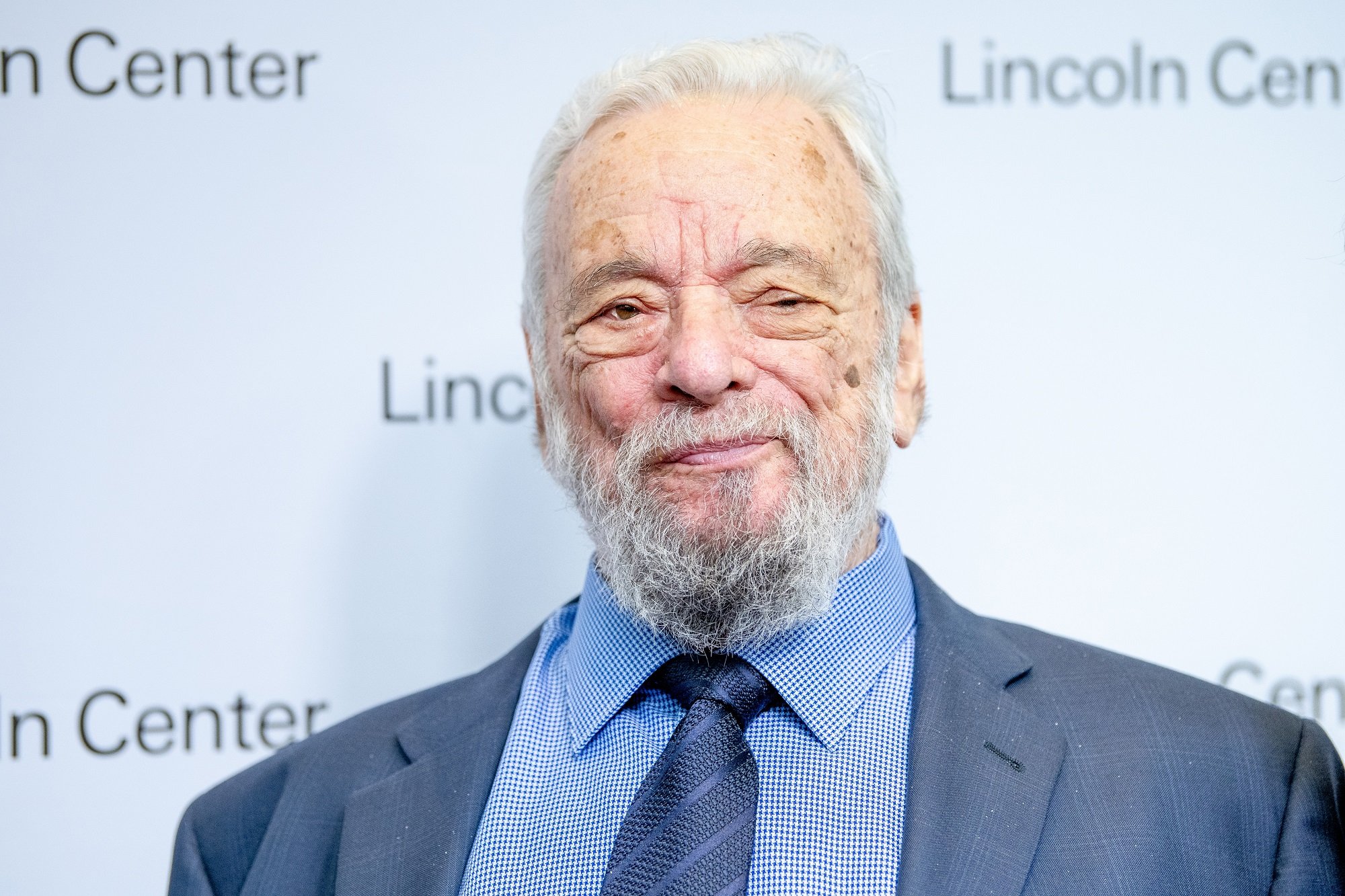 Stephen Sondheim, pictured here in a blue suit with a blue shirt and a blue tie, has died