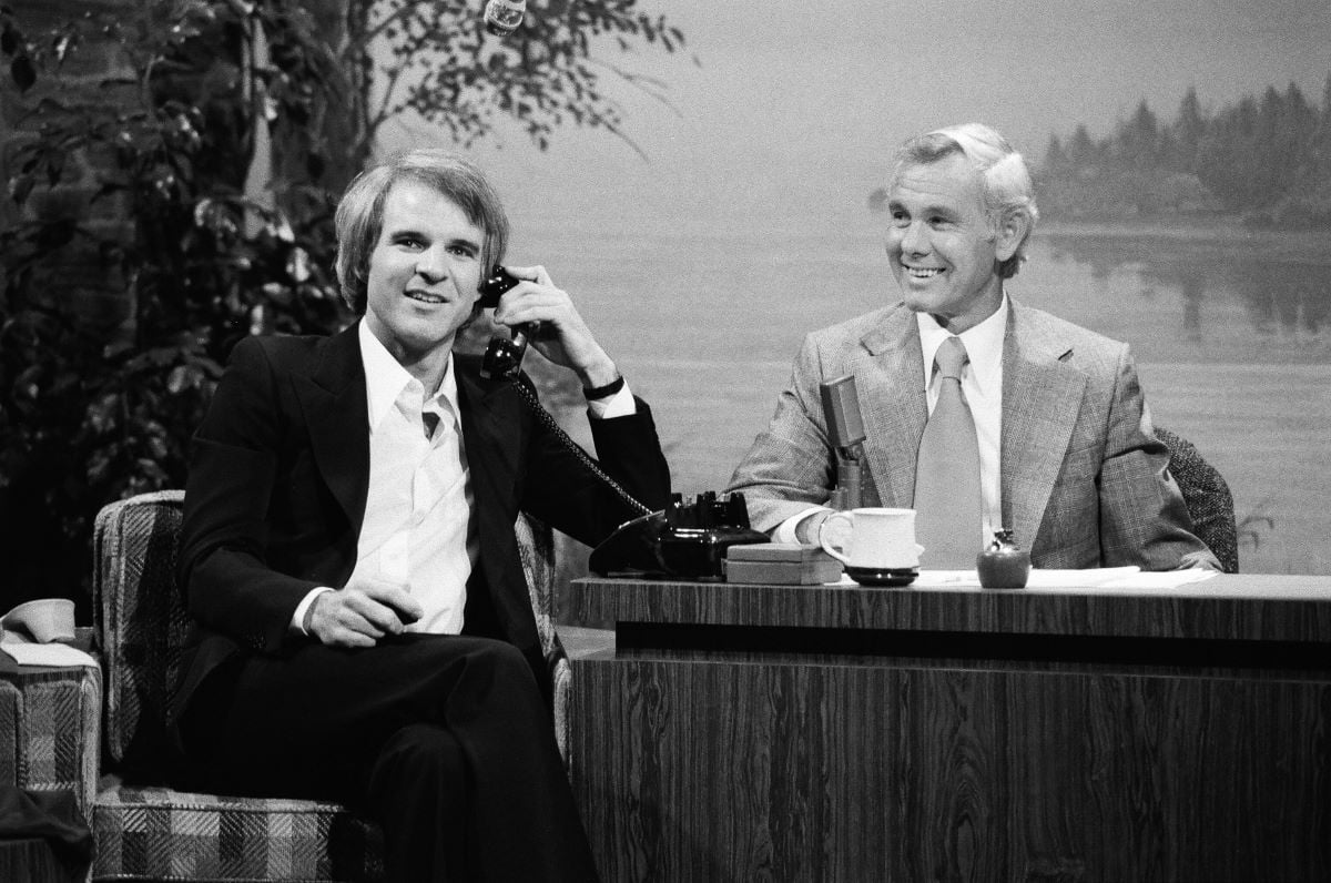 Steve Martin pretends to talk on a phone during an interview with host Johnny Carson on October 28, 1976
