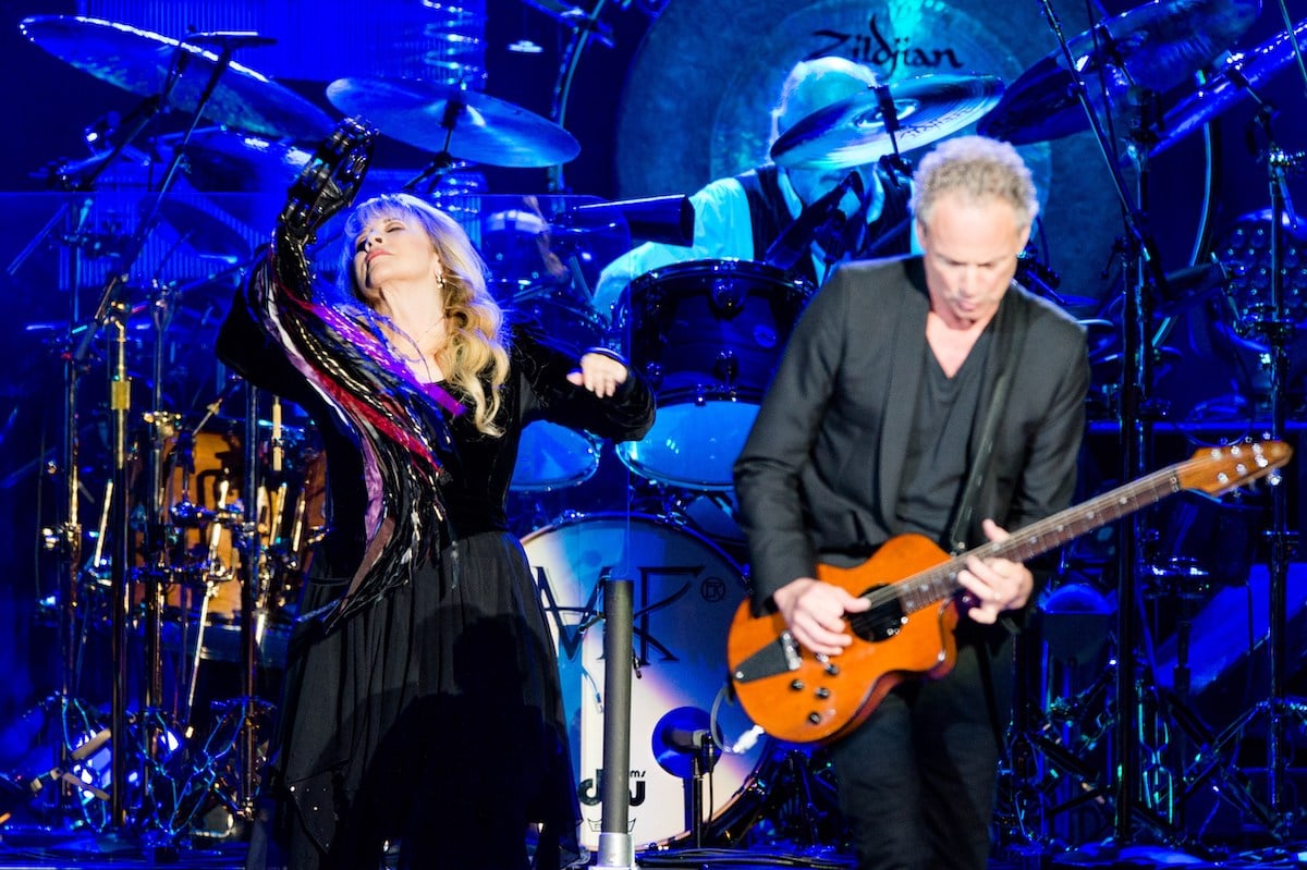 Stevie Nicks and Lindsey Buckingham perform on stage.