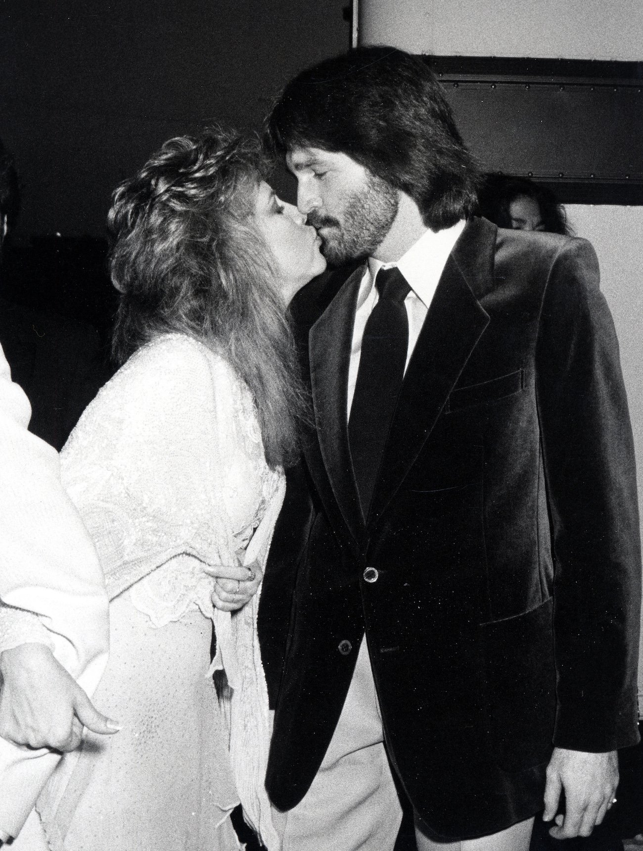 Stevie Nicks and her then-husband, Kim Anderson kissing.