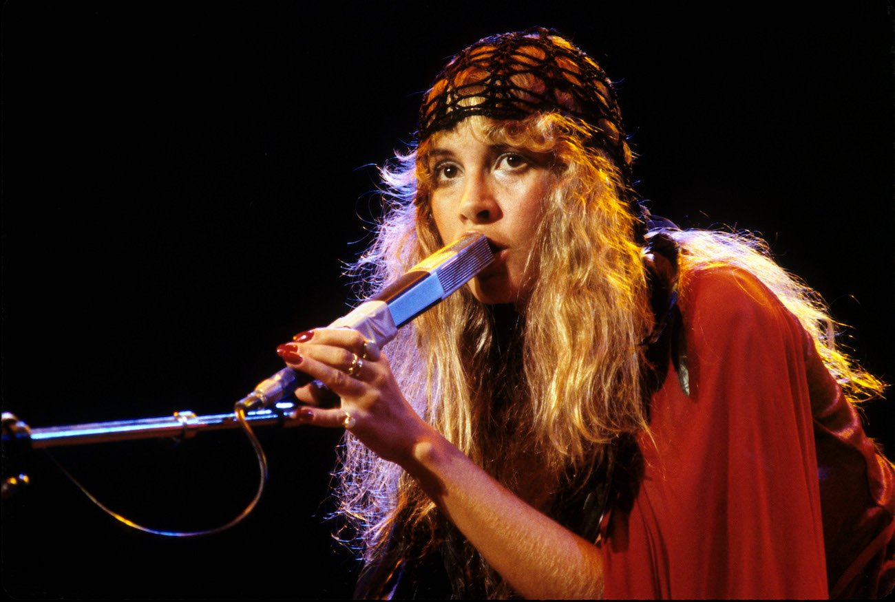 Stevie Nicks wearing a scarf around her head performing with Fleetwood  Mac, 1978.