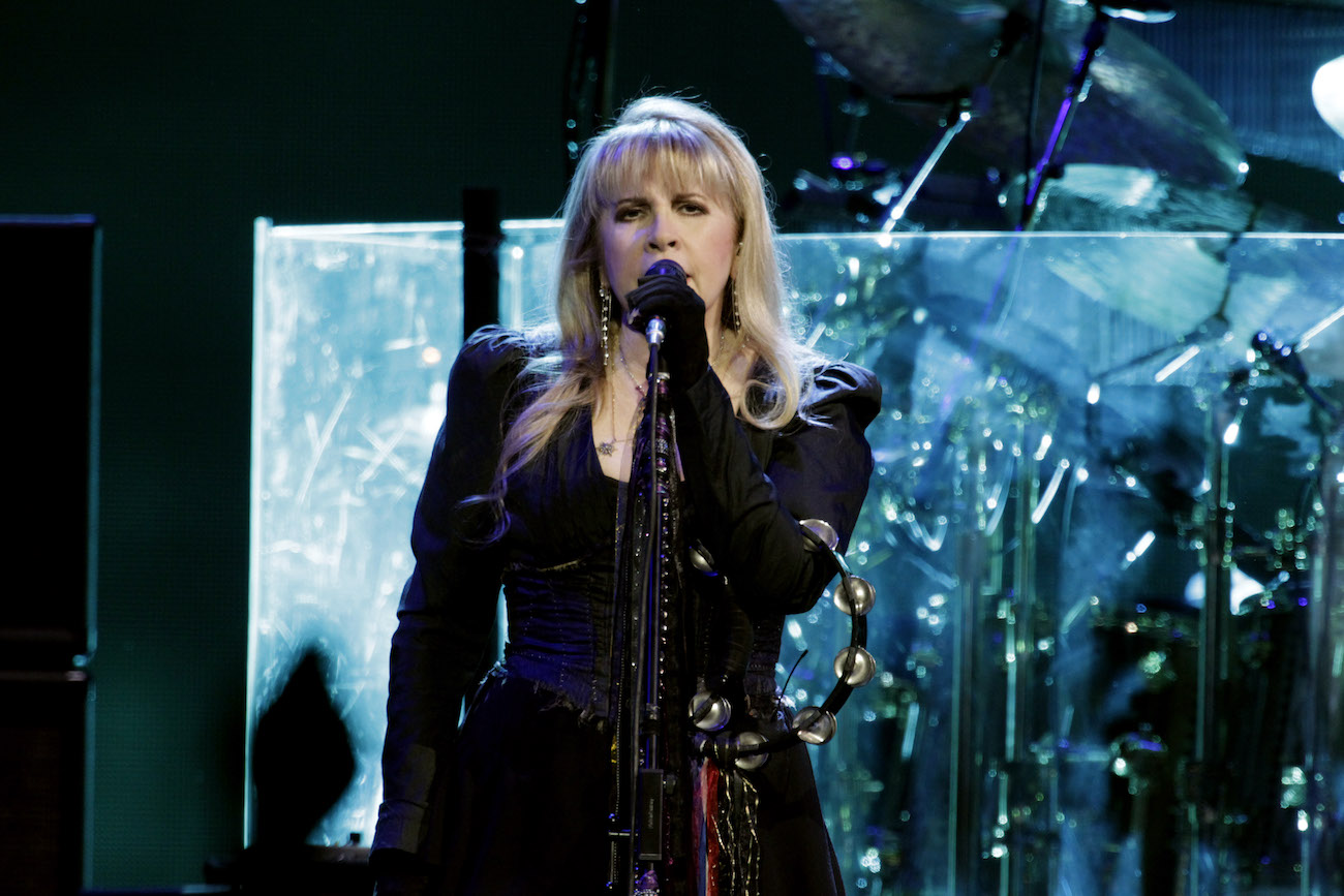 Stevie Nicks wearing black while performing with Fleetwood Mac, 2015.